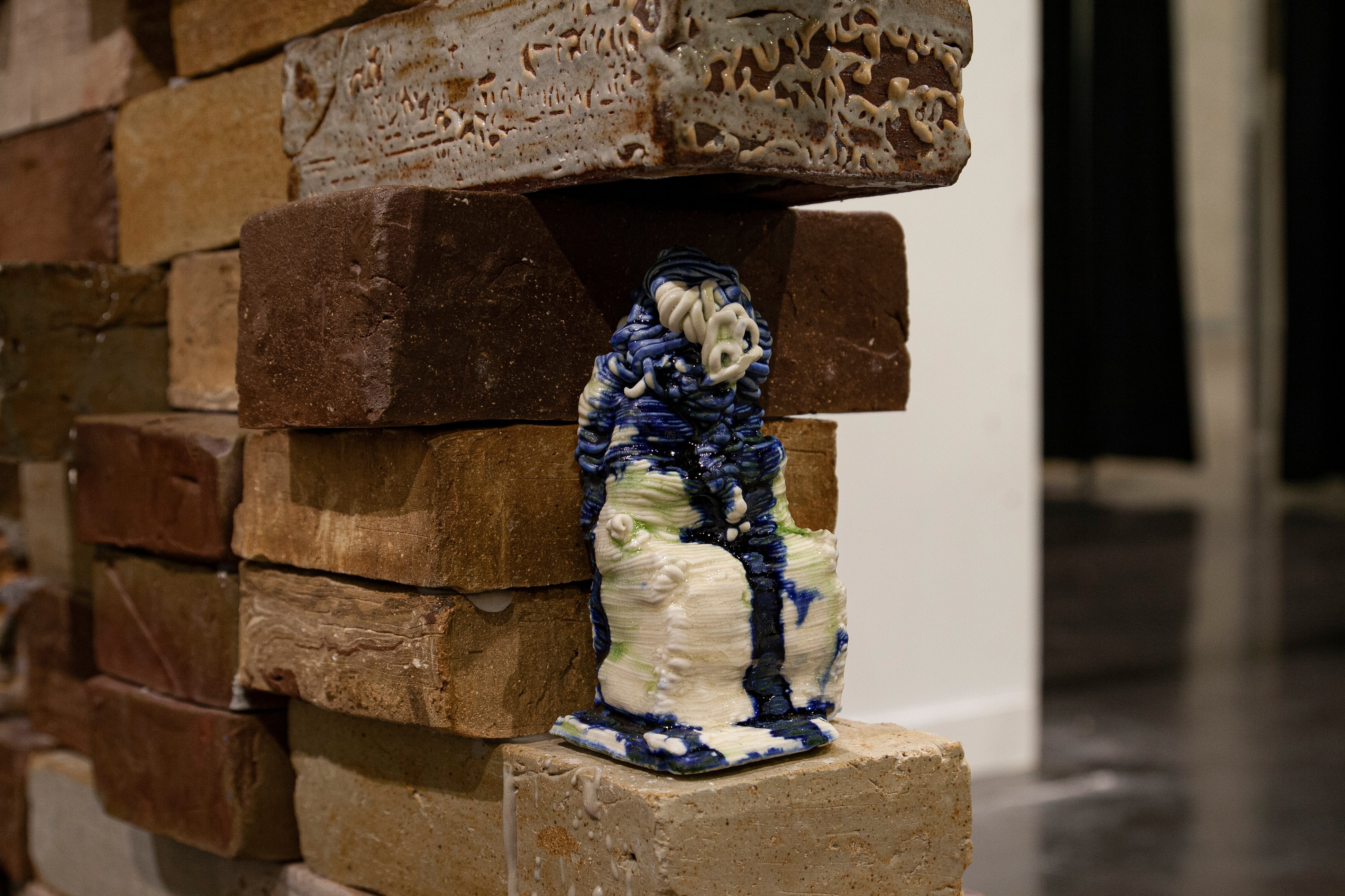 close up of brick wall filled with small objects printed from historical scans
