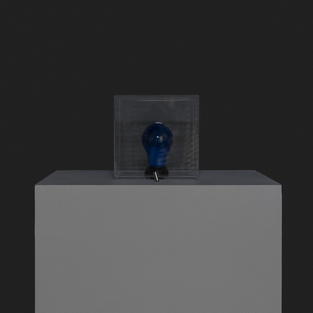 A square lamp with a toggle switch in the front.