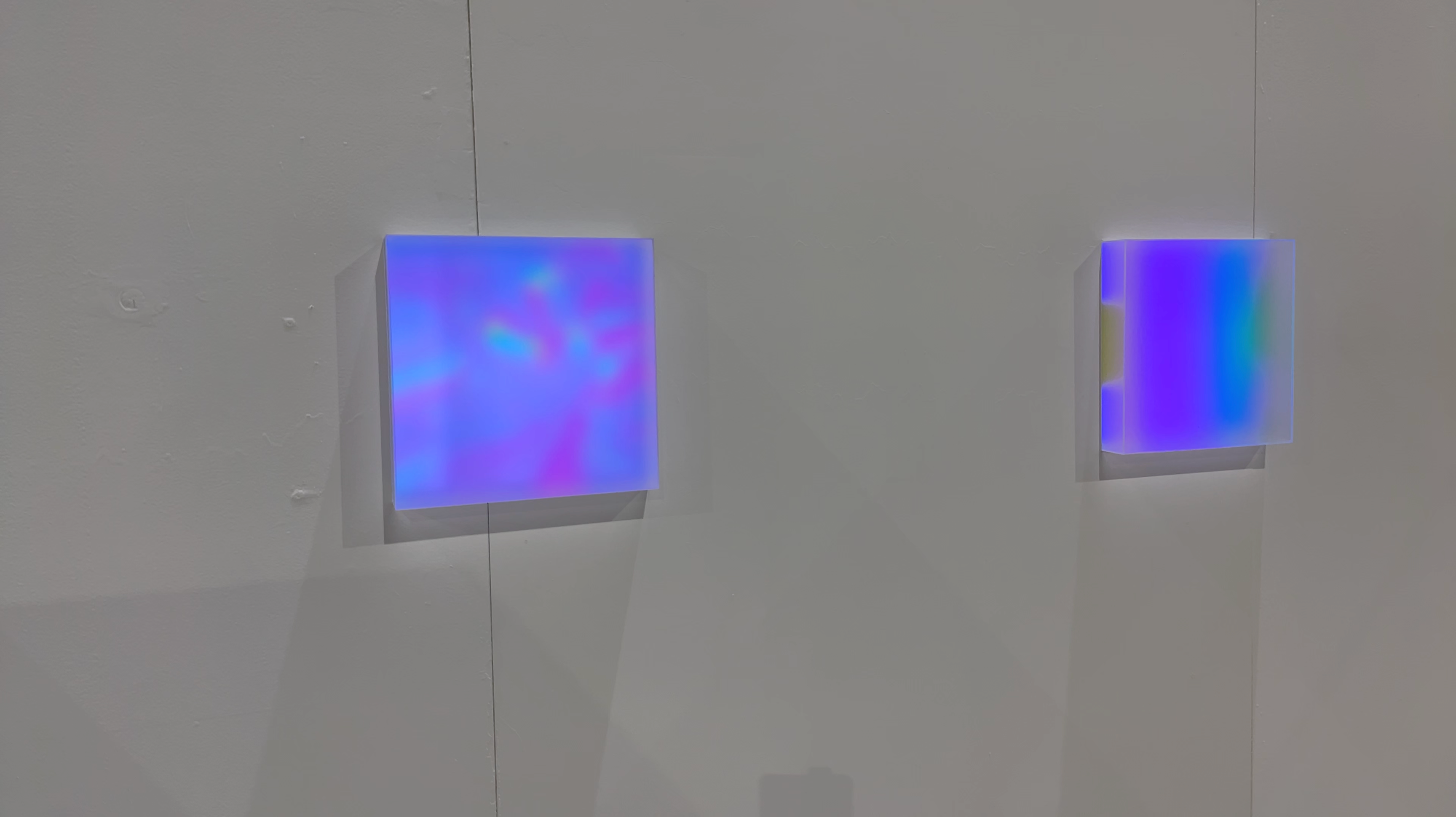Photo documentation of installation featuring a close-up of two of the three light boxes.