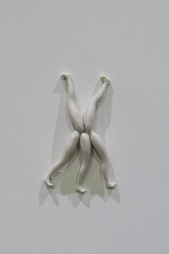 A detail shot of multiple sculptures on individual shelves