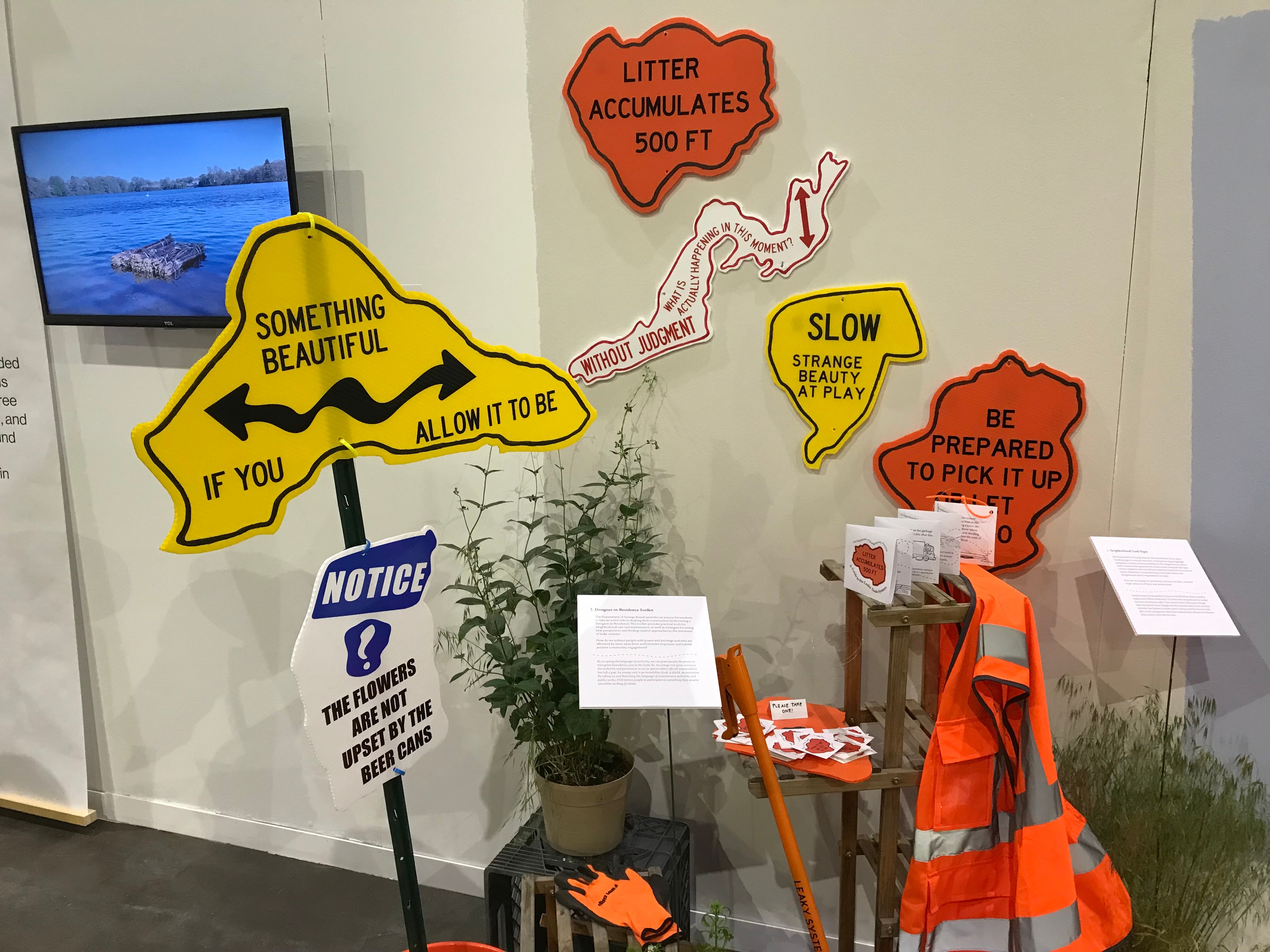 Installation view of Neighborhood Trash Signs