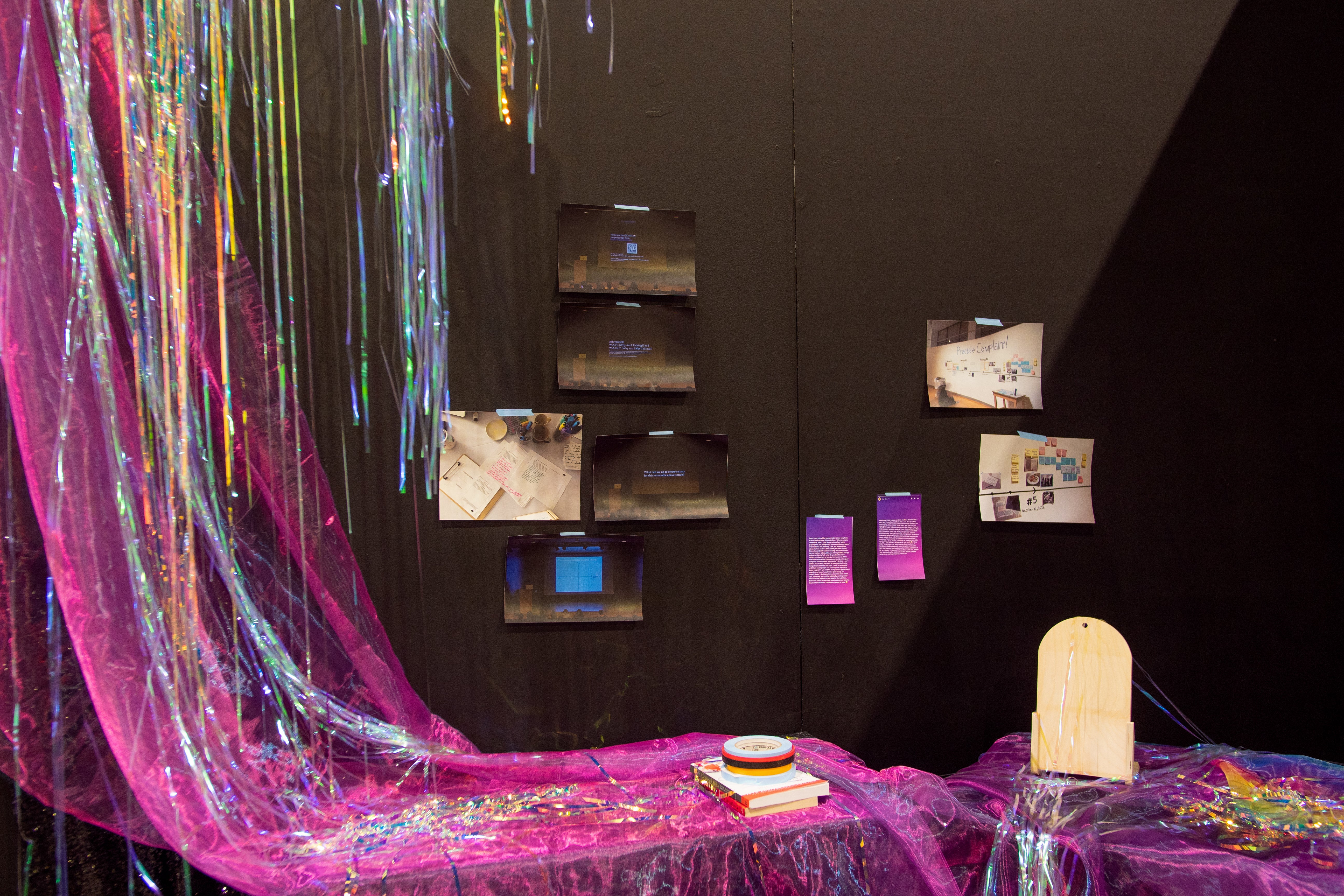 iridescent sheer Fuschia with blue organza, iridescent vinyl party streamers, photo documents and Instagram stories printed on paper, artist tapes, 'Cruising Utopia' by José Esteban Muñoz 'All About Love: New Visions' by bell hooks, and wooden board.