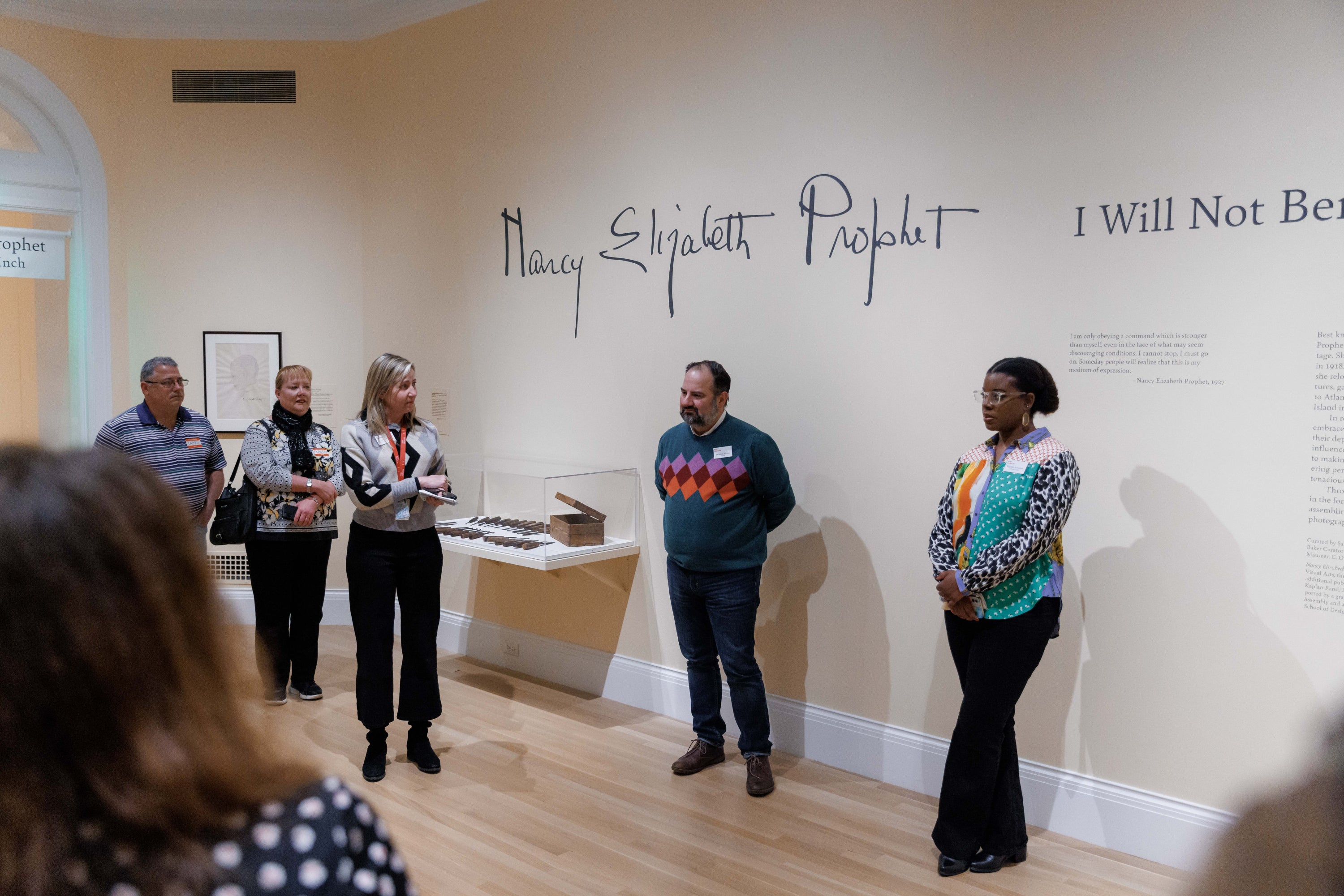 people standing in a gallery