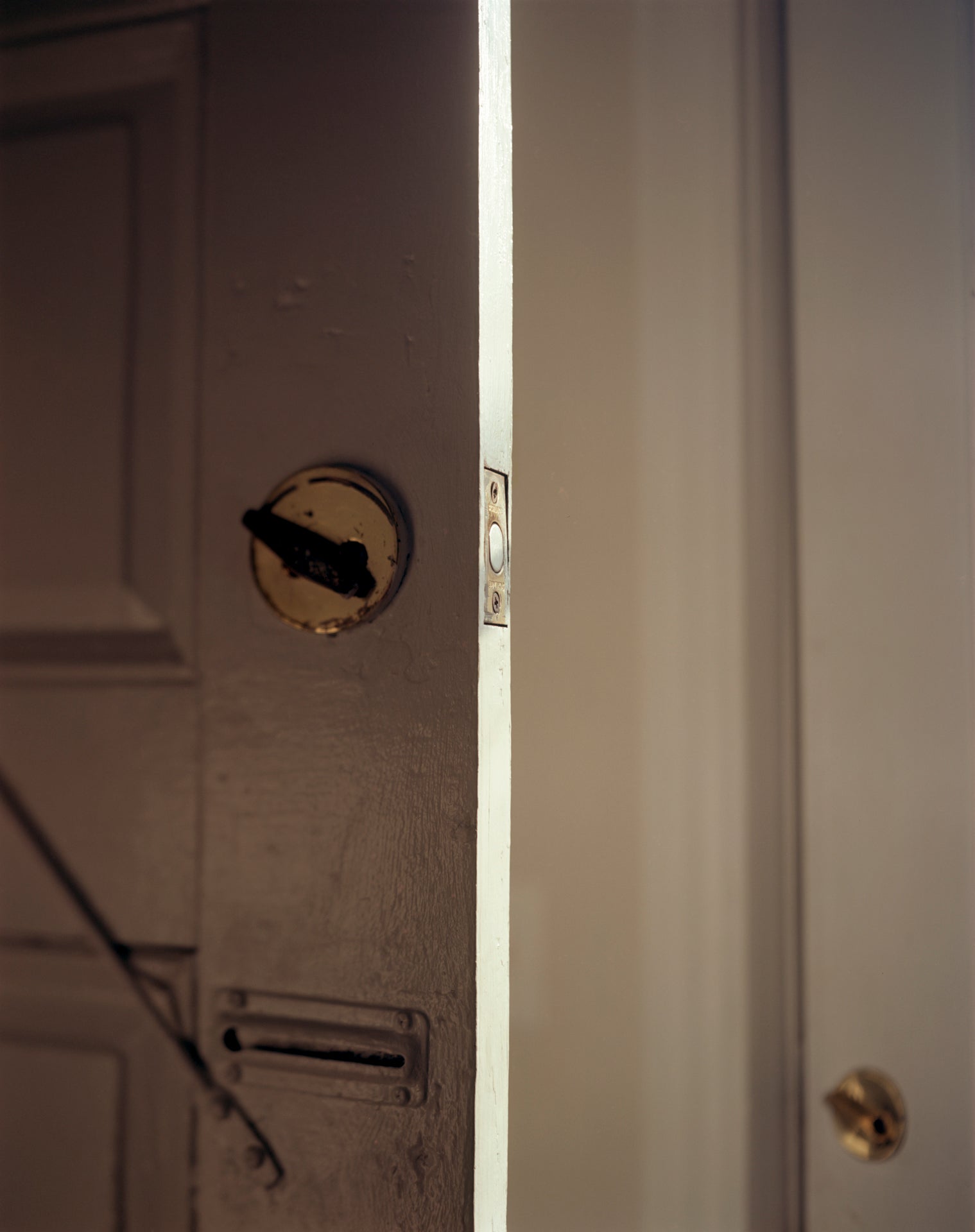 /Photograph%20of%20two%20white%20doors.%20The%20open%20door%20on%20the%20left%27s%20lock%20latch%20is%20angled%20left.%20In%20the%20bottom%20right%20is%20the%20the%20second%20door%27s%20lock.%20it%20is%20also%20angled%20left.