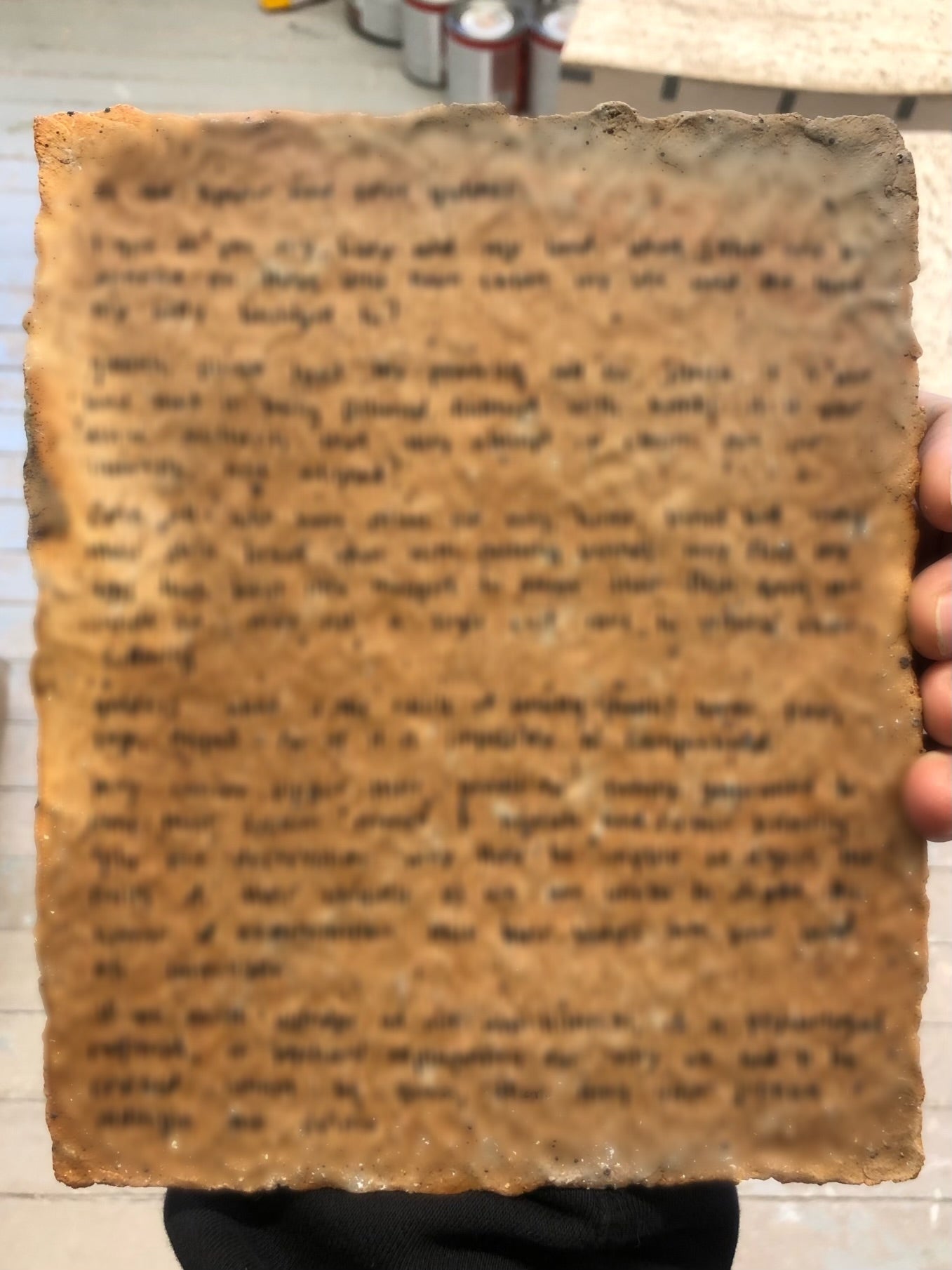 /Back%20of%20tablet%3A%20writing%20printed%20in%20uv%20ink%20has%20been%20blurred%20out%20to%20hide%20the%20curse%20from%20human%20eyes%2C%20protecting%20its%20efficacy%20