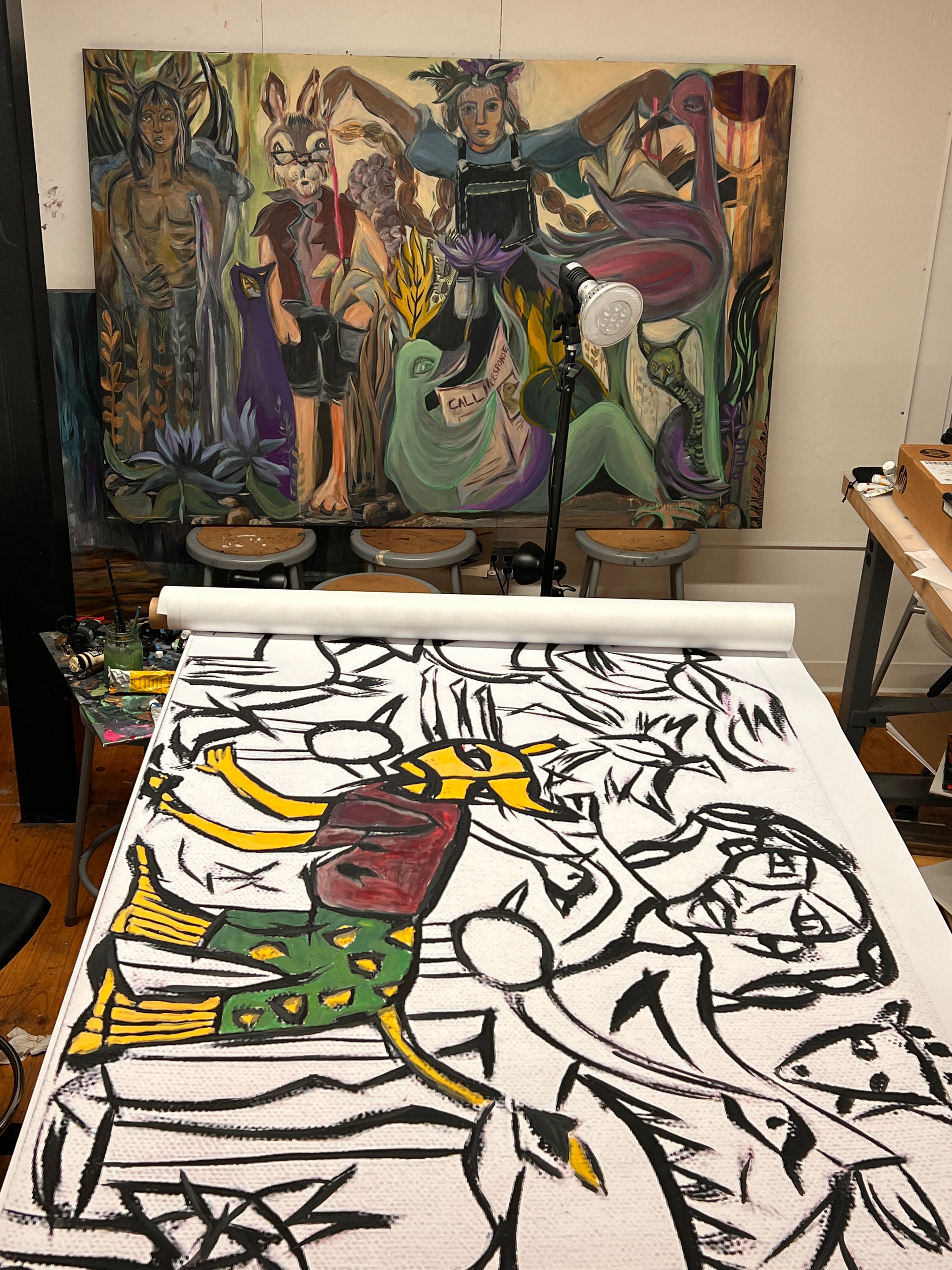 Two paintings in a studio space