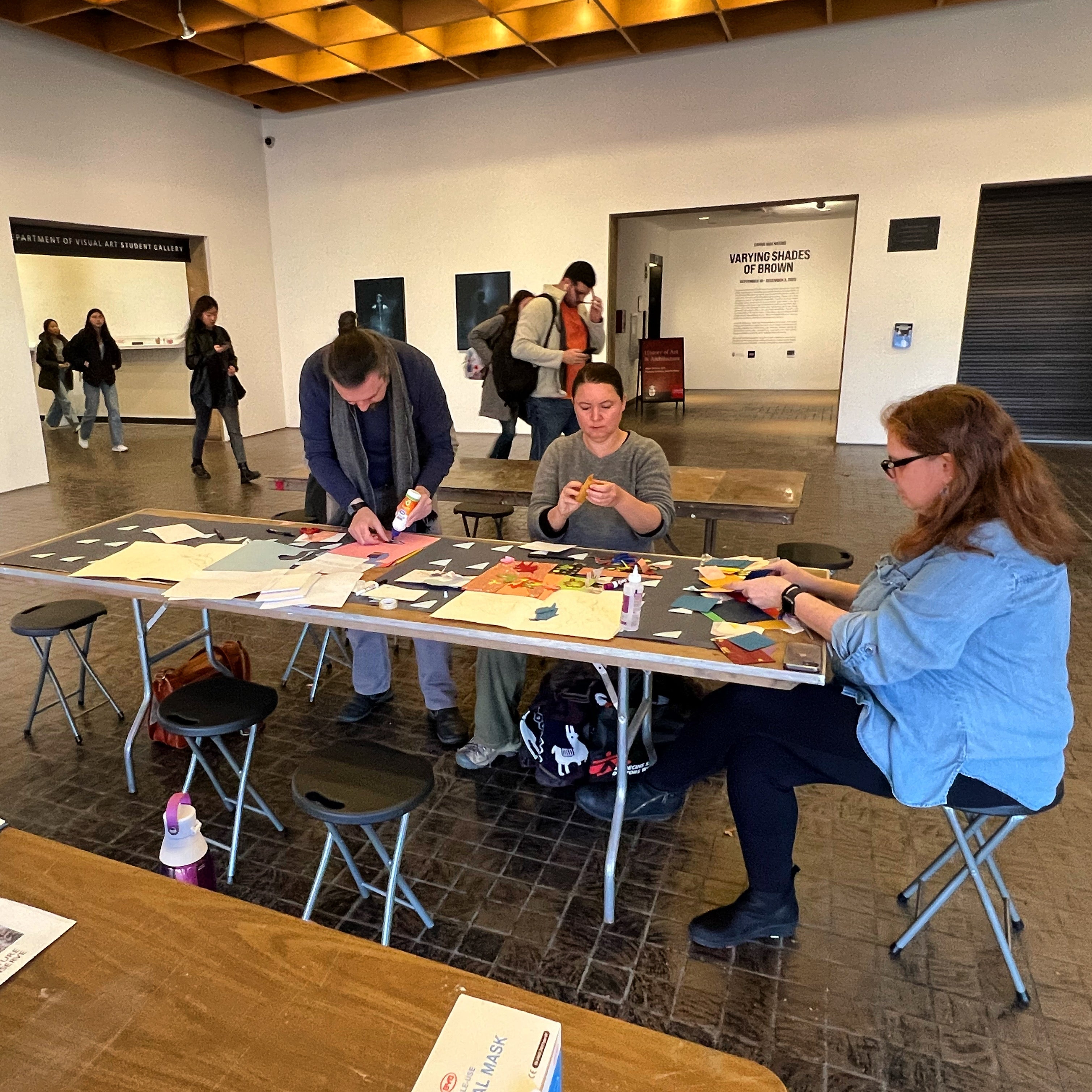 /Participants%20of%20the%20workshop%20work%20around%20a%20table%20on%20a%20collaborative%20Illustration