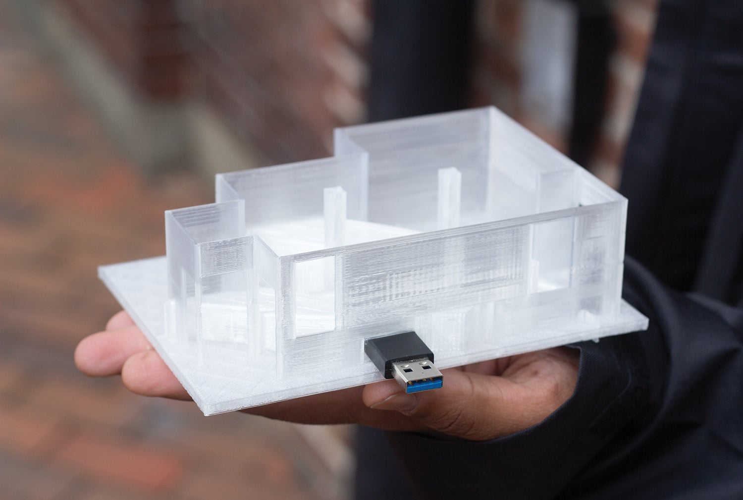 /A%203D-printed%20model%20of%20a%20room%20with%20a%20USB%20stick%20mounted%20on%20the%20side%20of%20it.