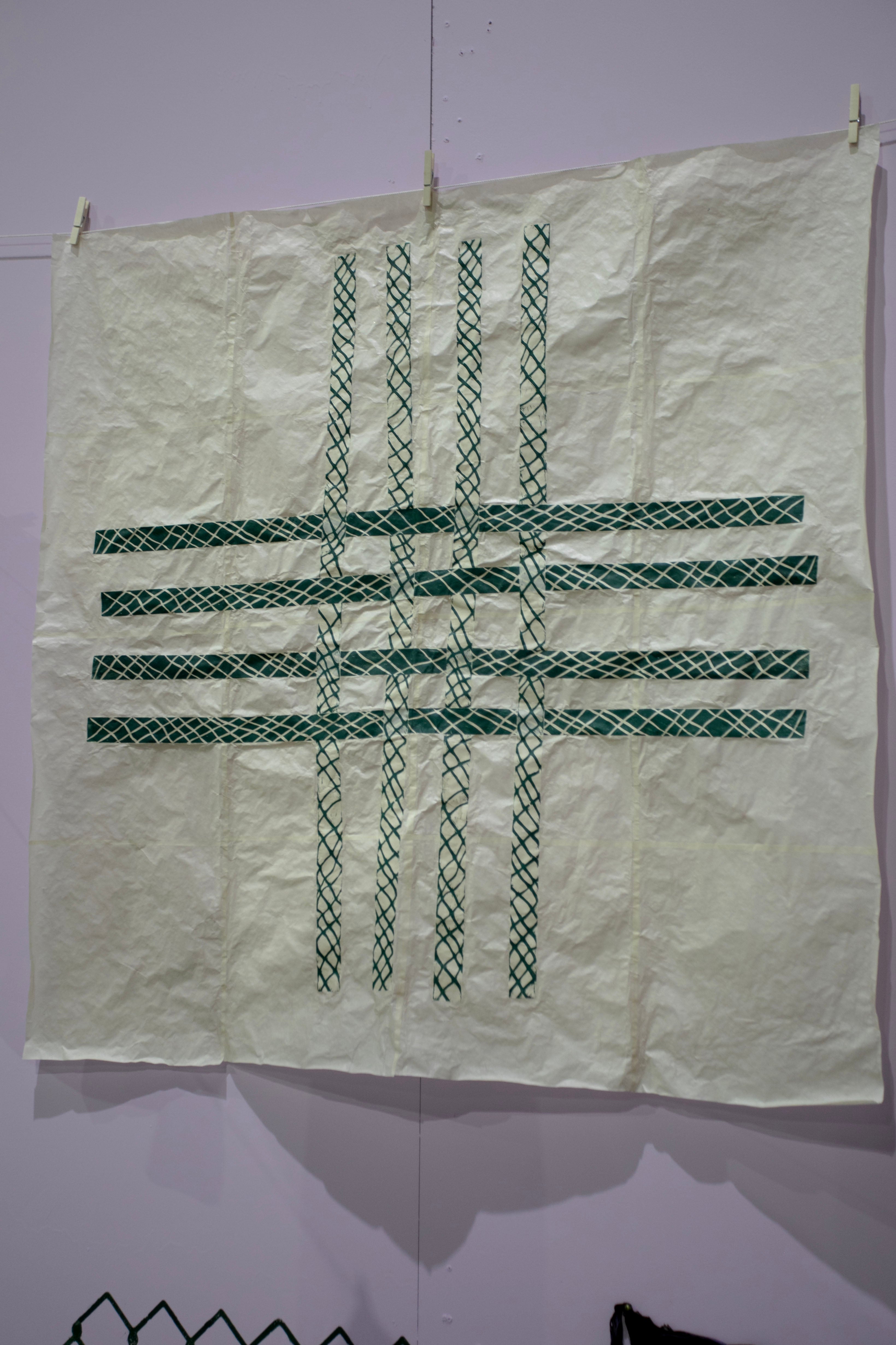 /image%20of%20green%20collaged%20prints%20assembled%20in%20a%20woven%20pattern