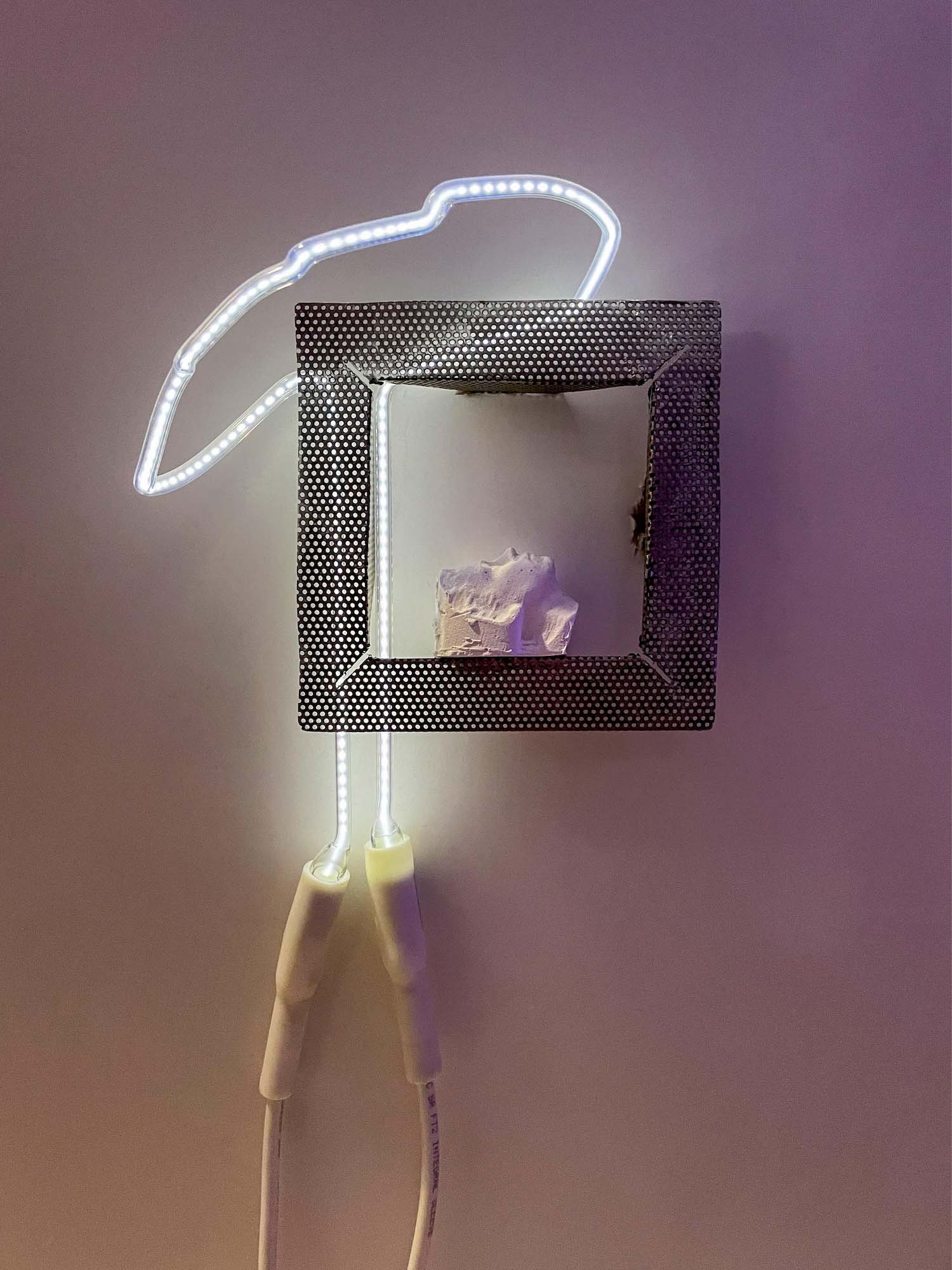 /white%20silouette%20with%20a%20slight%20purple%20hue%2C%20facing%20upward%20within%20the%20frame%20of%20perferated%20steel%2C%20a%20squiggle%20of%20neon%20light%20in%20a%20white%20color%20with%20dotted%20pattern%20and%20wiring%20is%20to%20the%20left%20