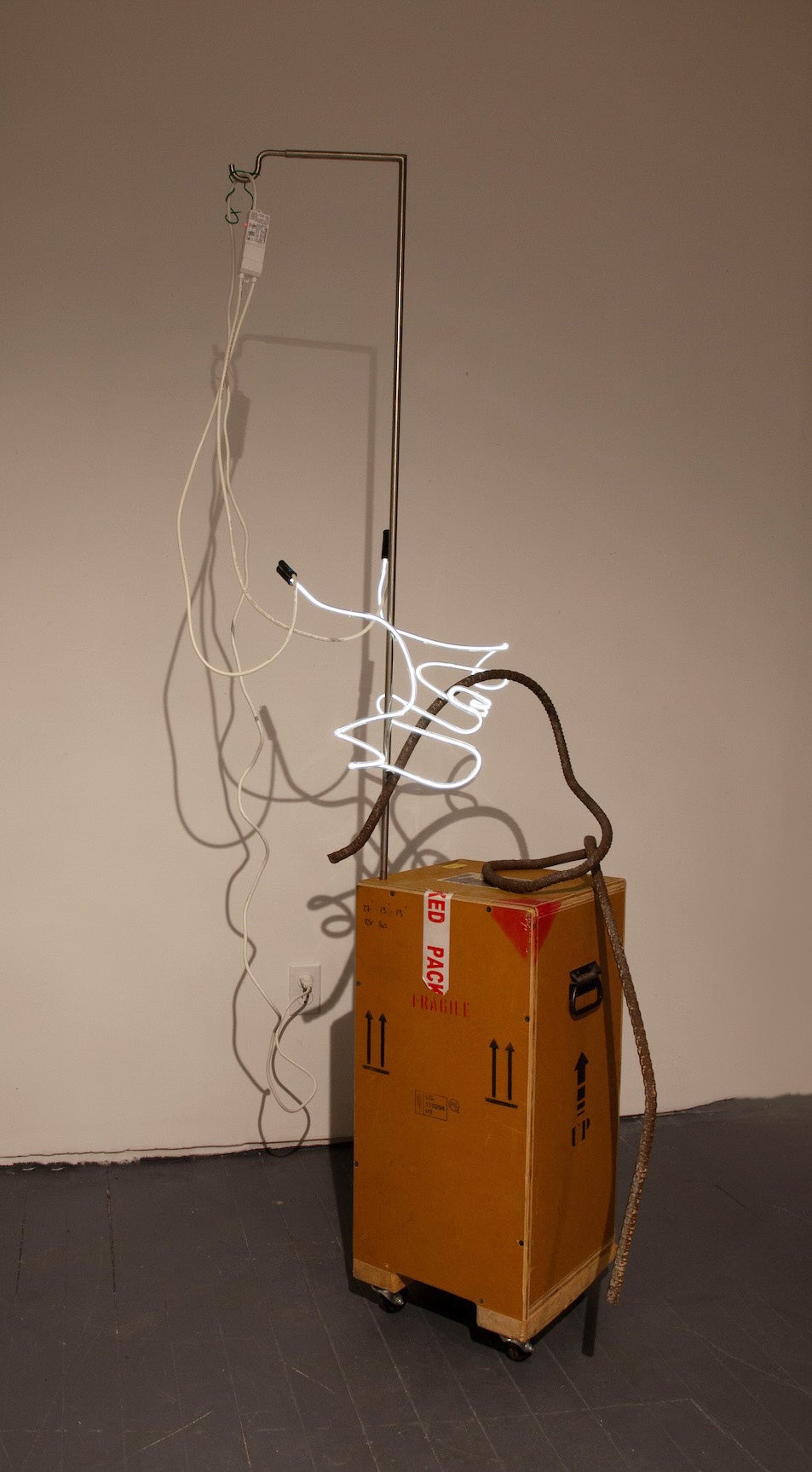 /an%20art%20crate%20on%20wheels%20with%20a%20white%20light%20squiggle%2C%20a%20mangled%20piece%20of%20rebar%2C%20wiring%2C%20and%20a%20stainless%20steel%20hook%20