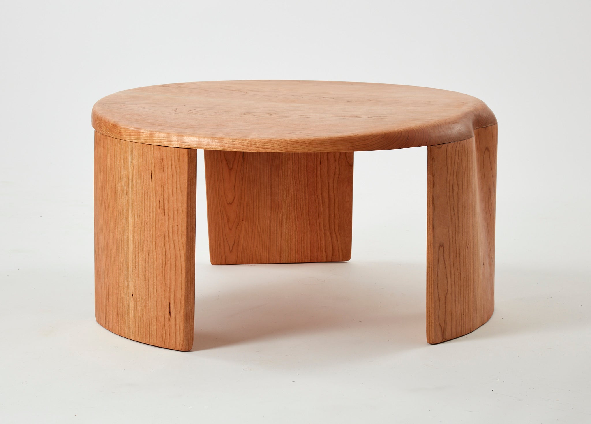 /This%20is%20a%20coffee%20table%20consisting%20of%20three%20legs%20and%20a%20tabletop.%20Both%20the%20tabletop%20and%20the%20legs%20are%20joined%20together%20with%20a%20slight%20curvature.