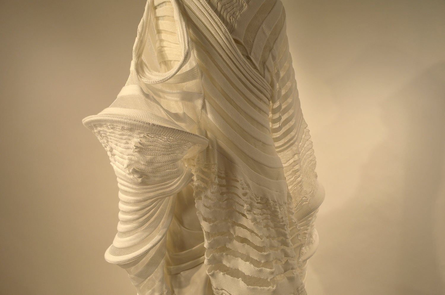 /The%20dimensional%20garment%2C%20inspired%20by%20a%20moth%20and%20the%20empty%20cocoon%20is%20fully%20wearable%20and%20draped%20around%20the%20body%20form.