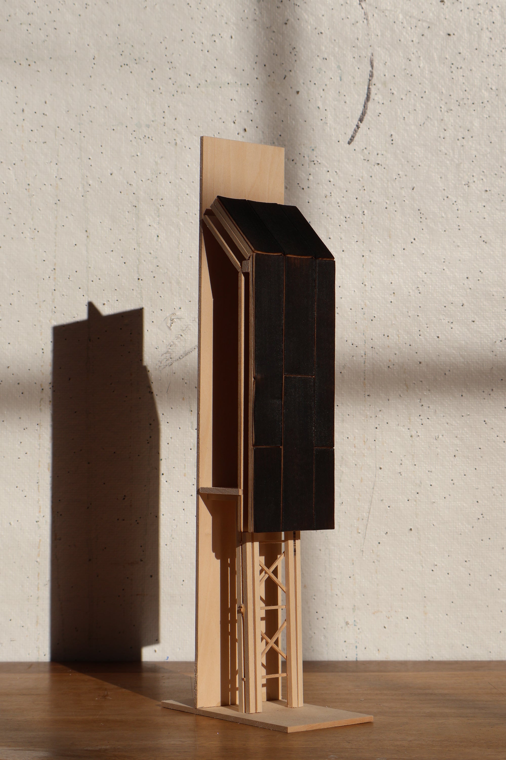 /An%20early%20material%20study%20explores%20charred%20wood%20on%20as%20a%20facade%20treatment