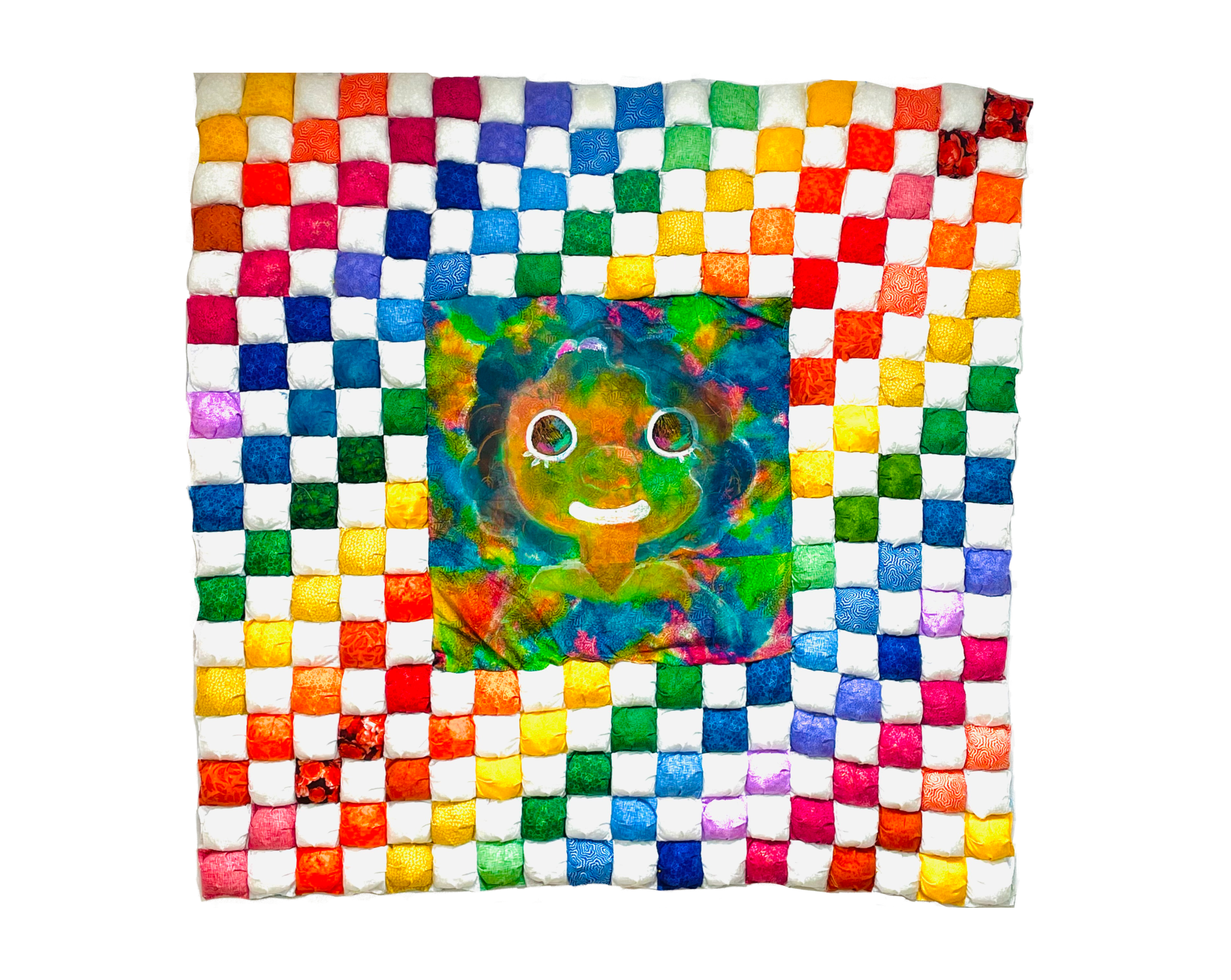 A puff quilt of white and all colors made up of many small squares. The middle of the quilt contains an image of a little girl smiling.