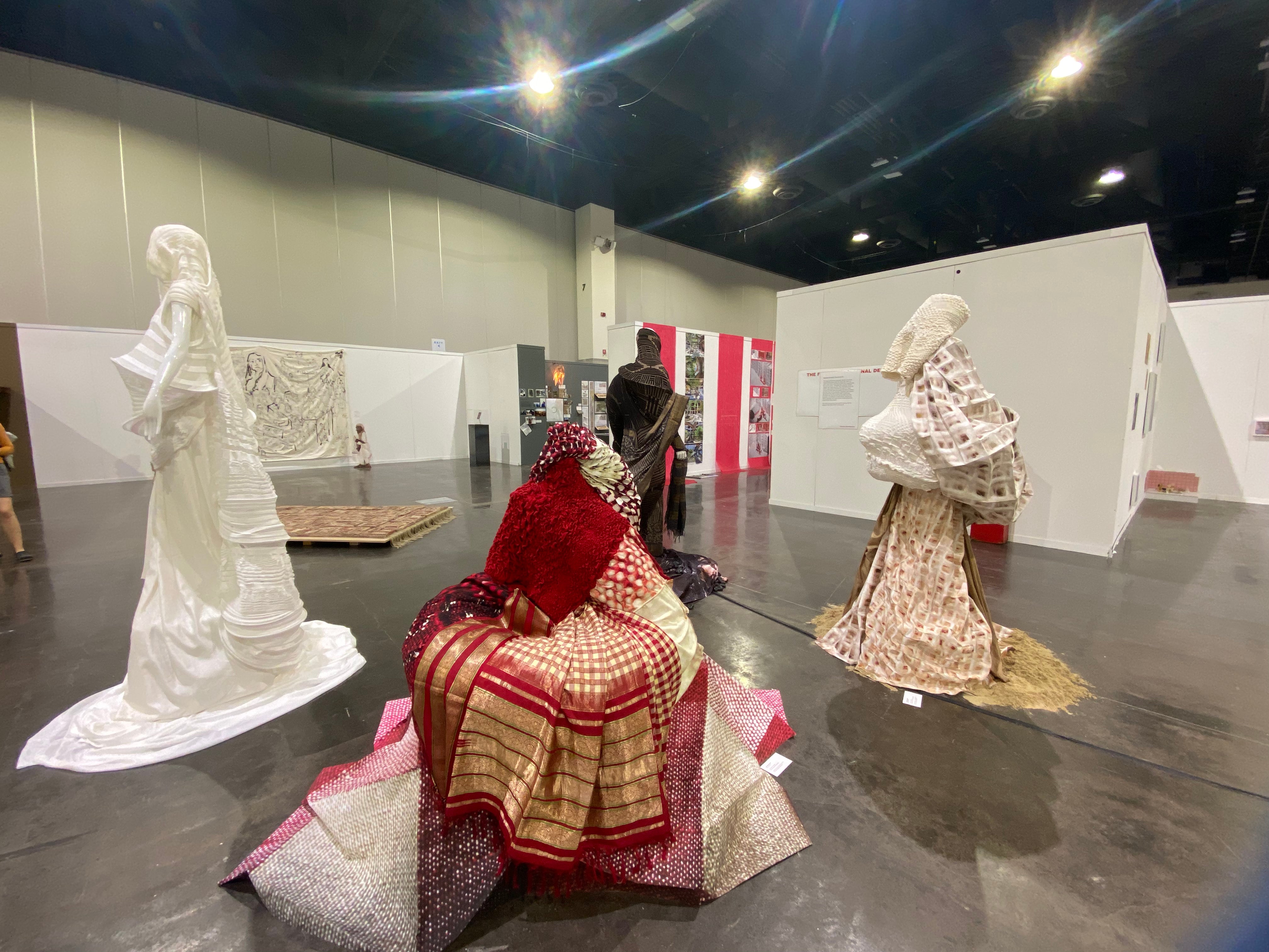 Placed in space, viewers are encouraged to walk around and interact individually with each garment. 