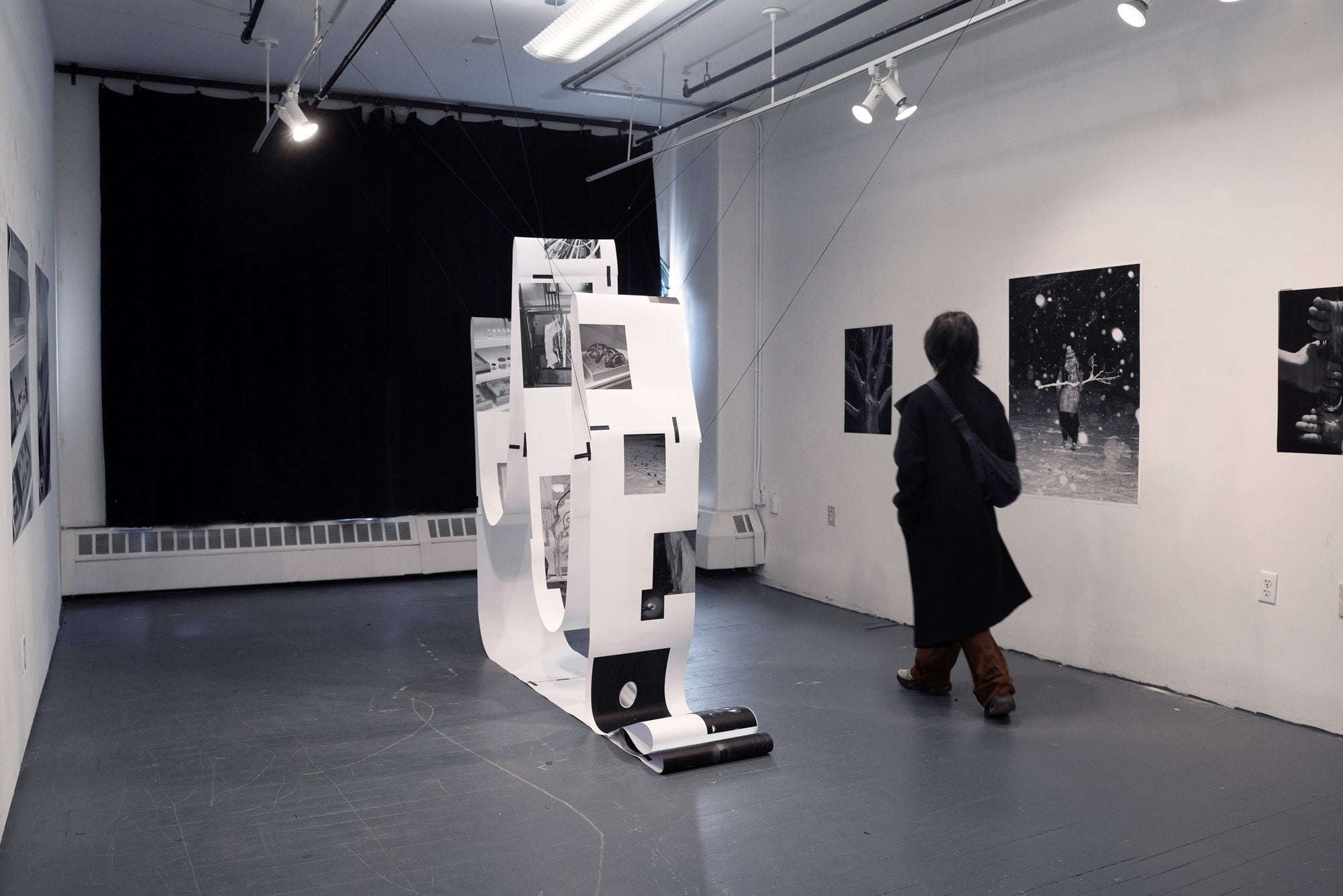 Installation exploring knowledge systems through questioning, with images as forms of knowing within space.