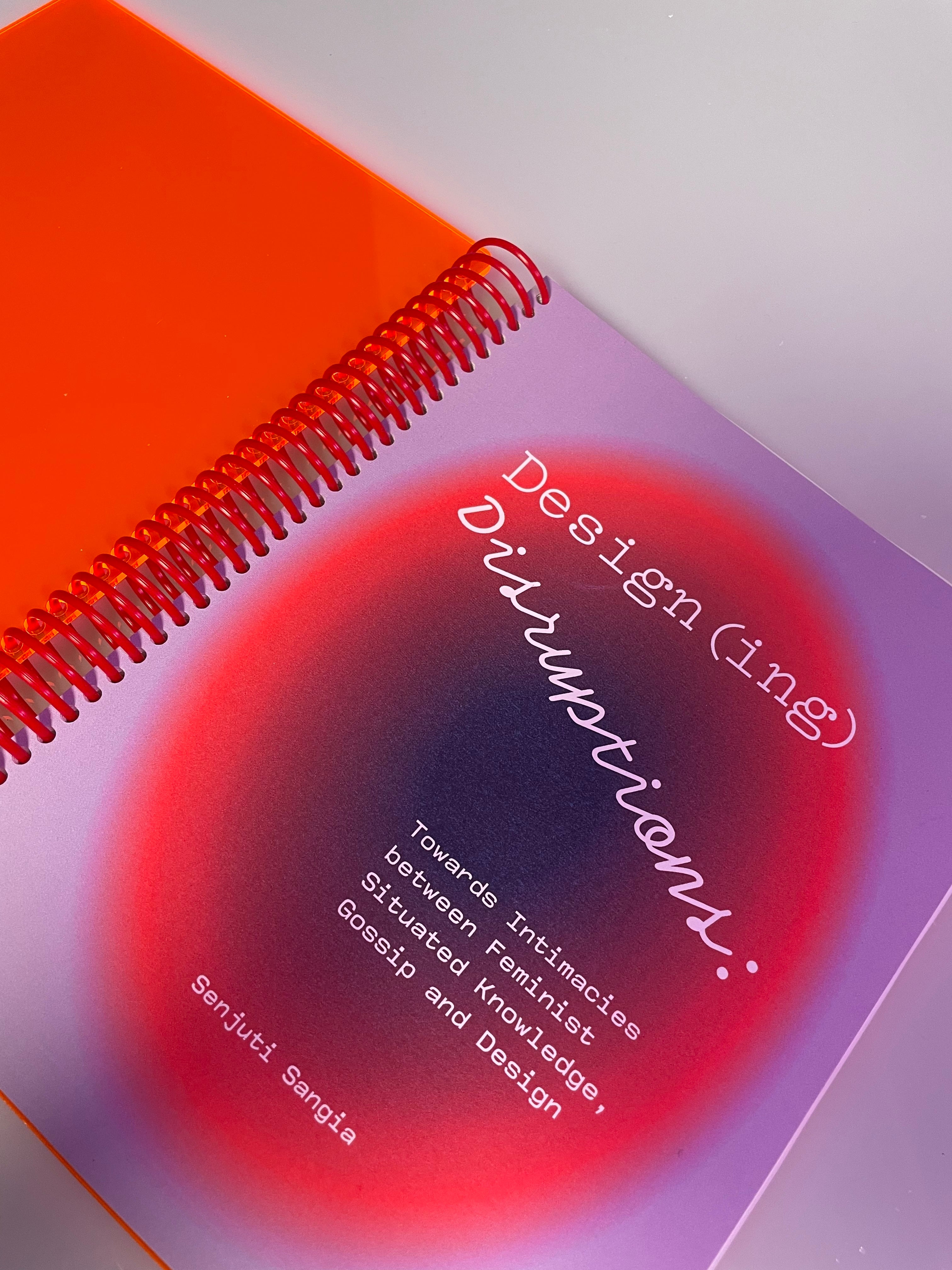 A lilac and orange cover of a spiral-bound book titled Design(ing) Disruptions by Senjuti Sangia. 