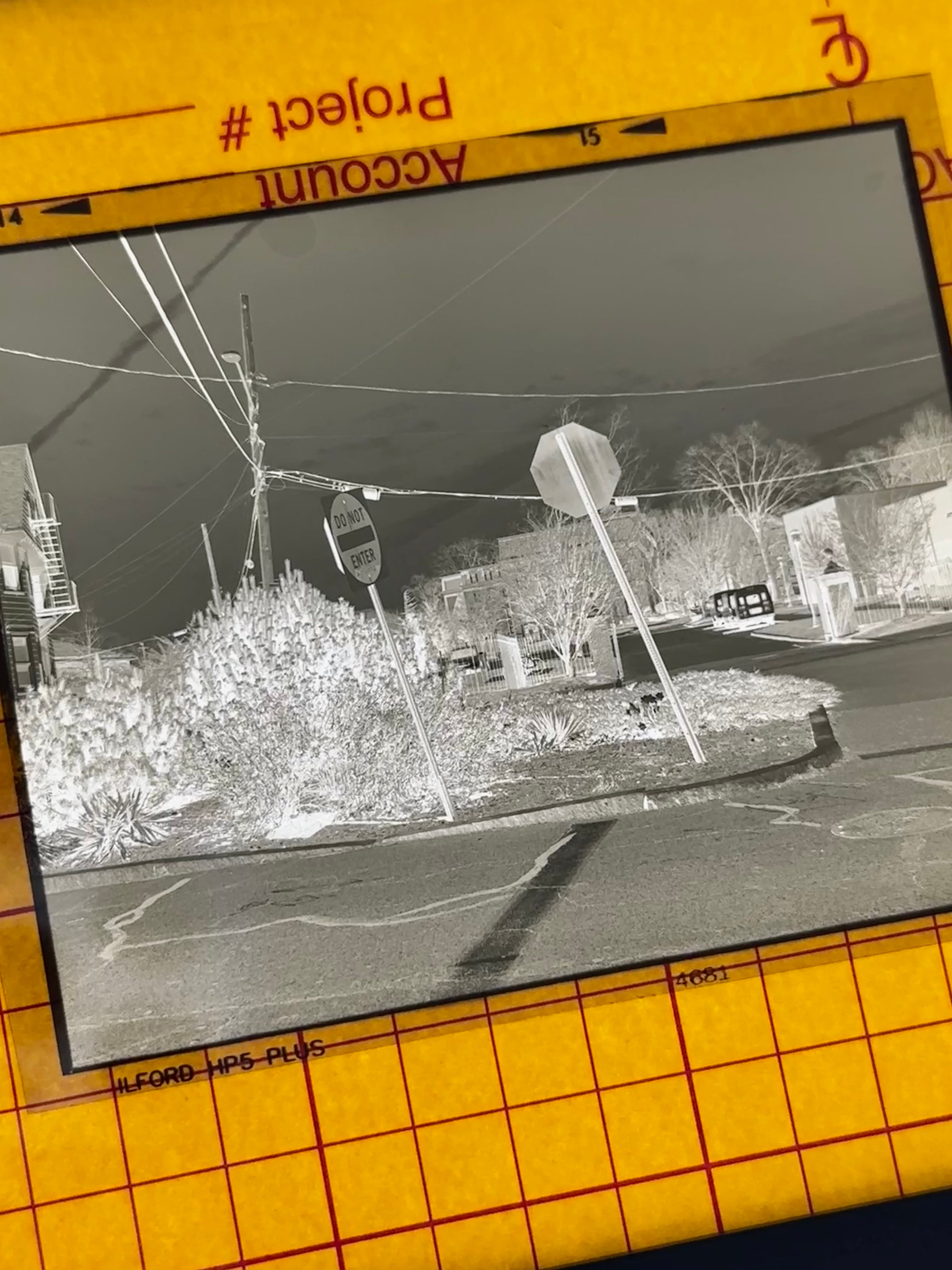 The negative of my print, taken in the middle of Hope St, showing my process: shooting, walking, developing, printing.