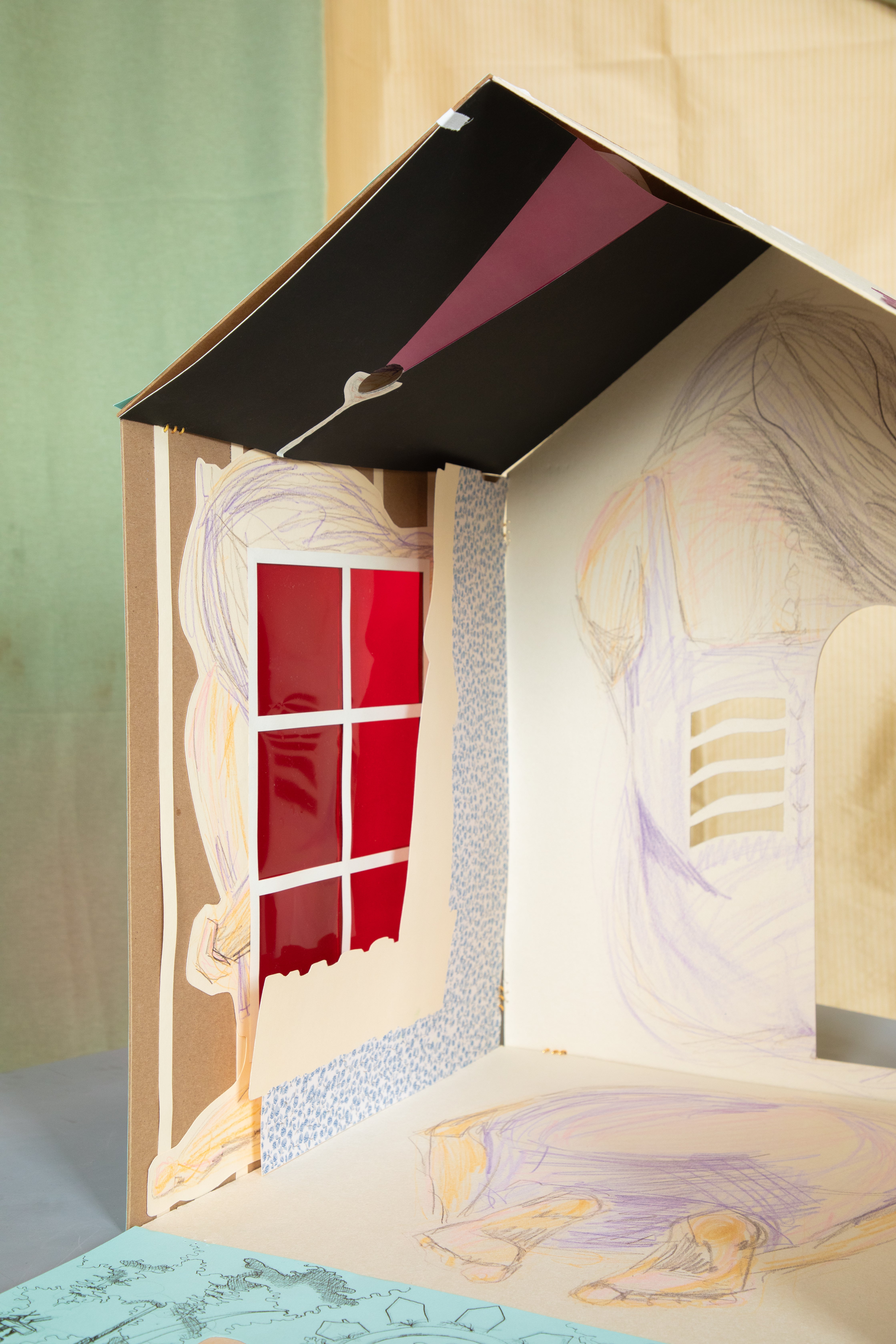 Interior view of house form with depictions of the human form drawing on the interior walls 