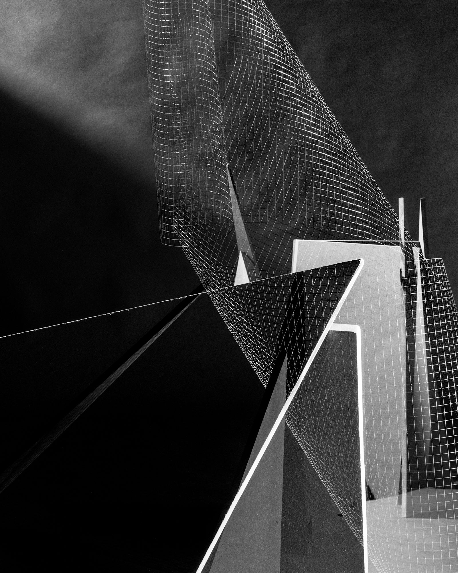 An image of metal mesh and angular shapes producing a strange experience of depth