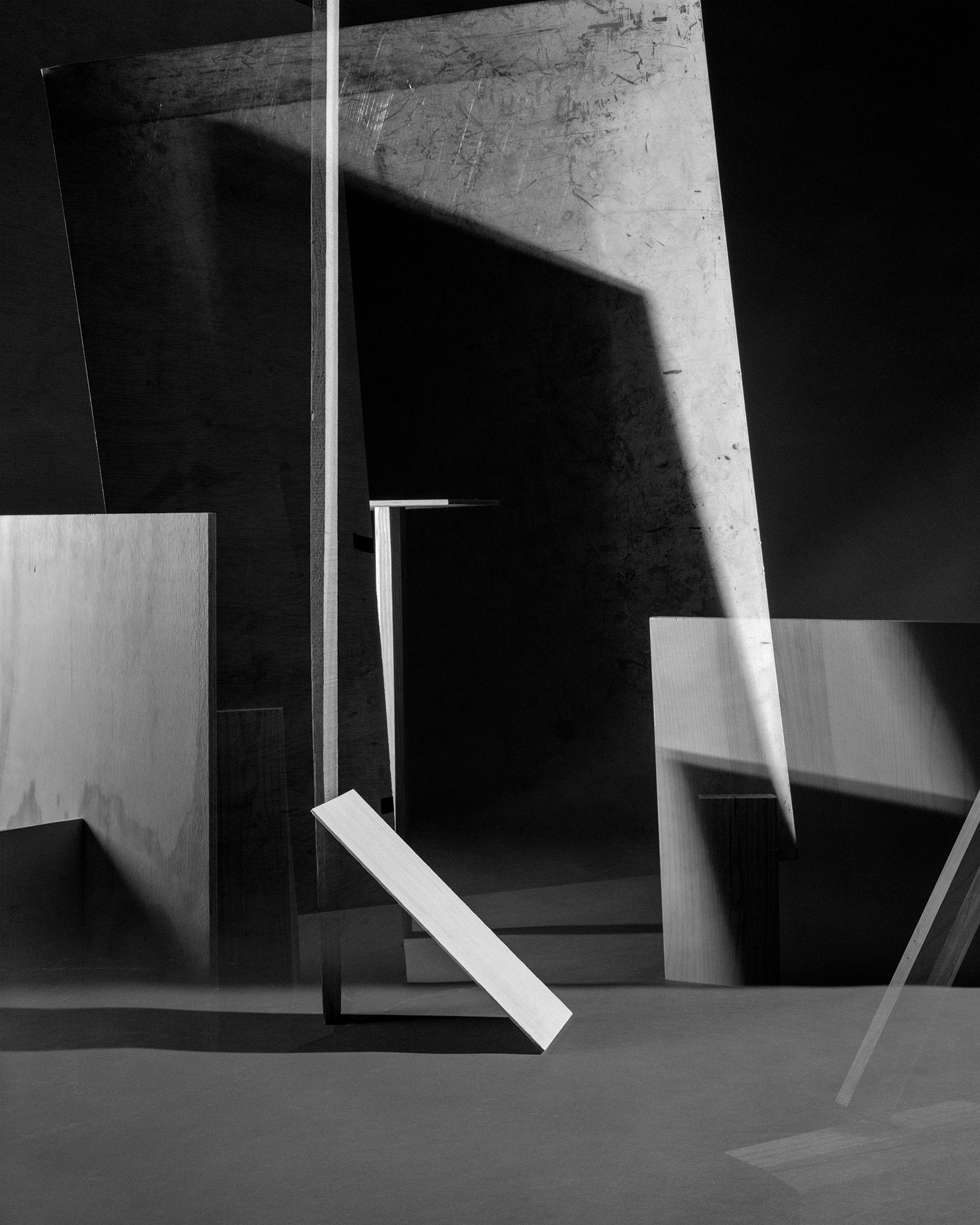 A photograph of sheet metal and planks of wood