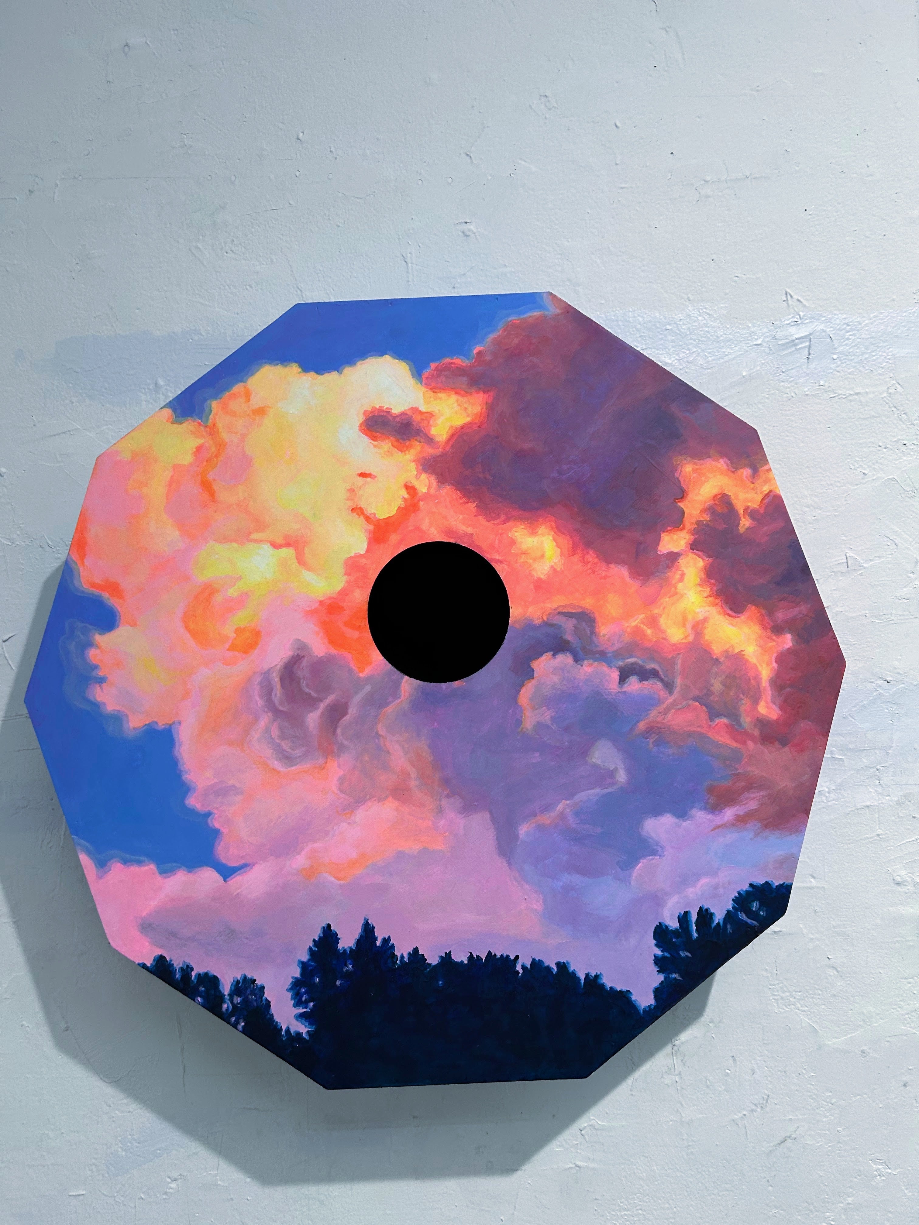 Cloud with black hole in center. 