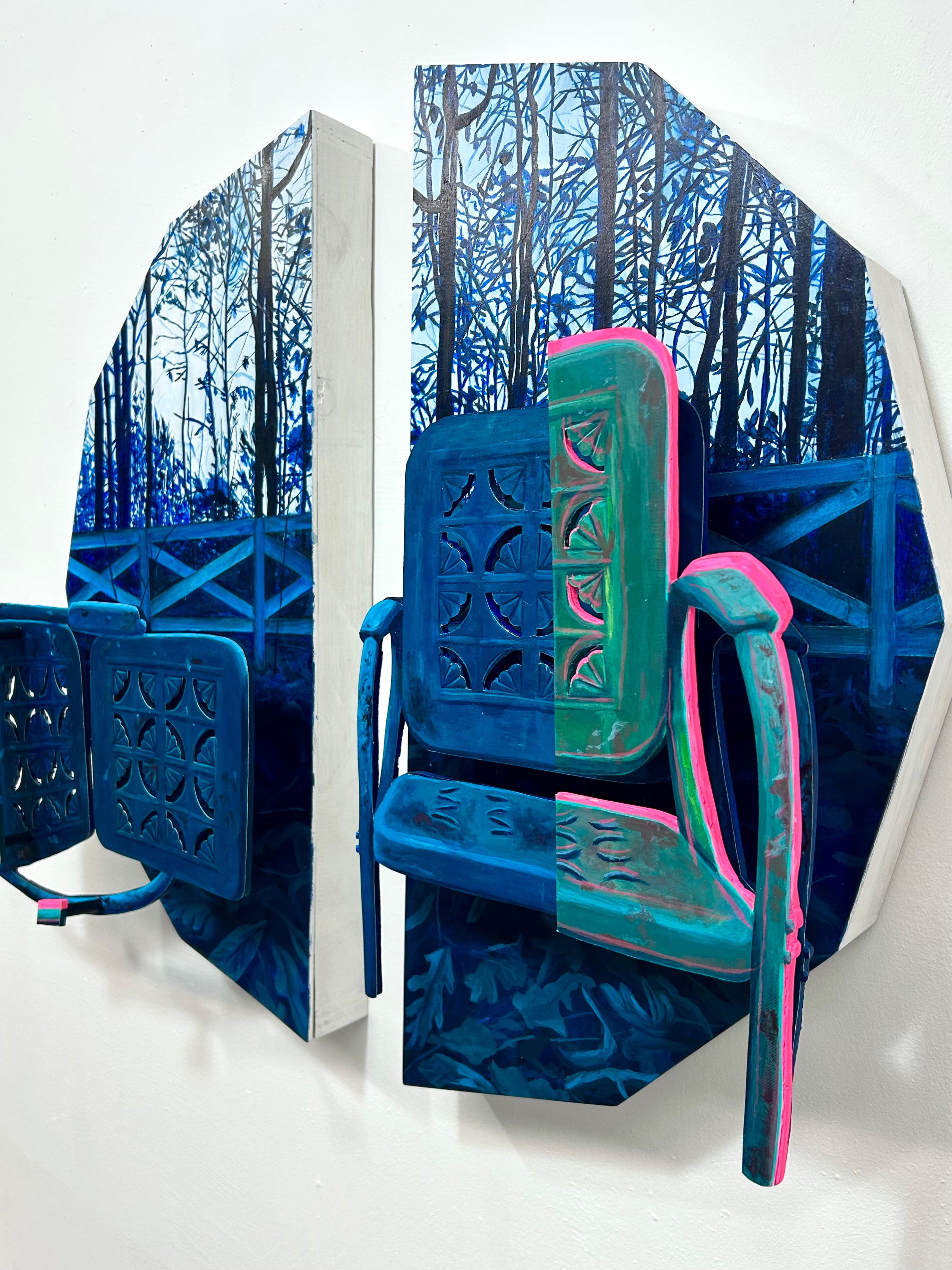 Side angle of two blue chairs. 