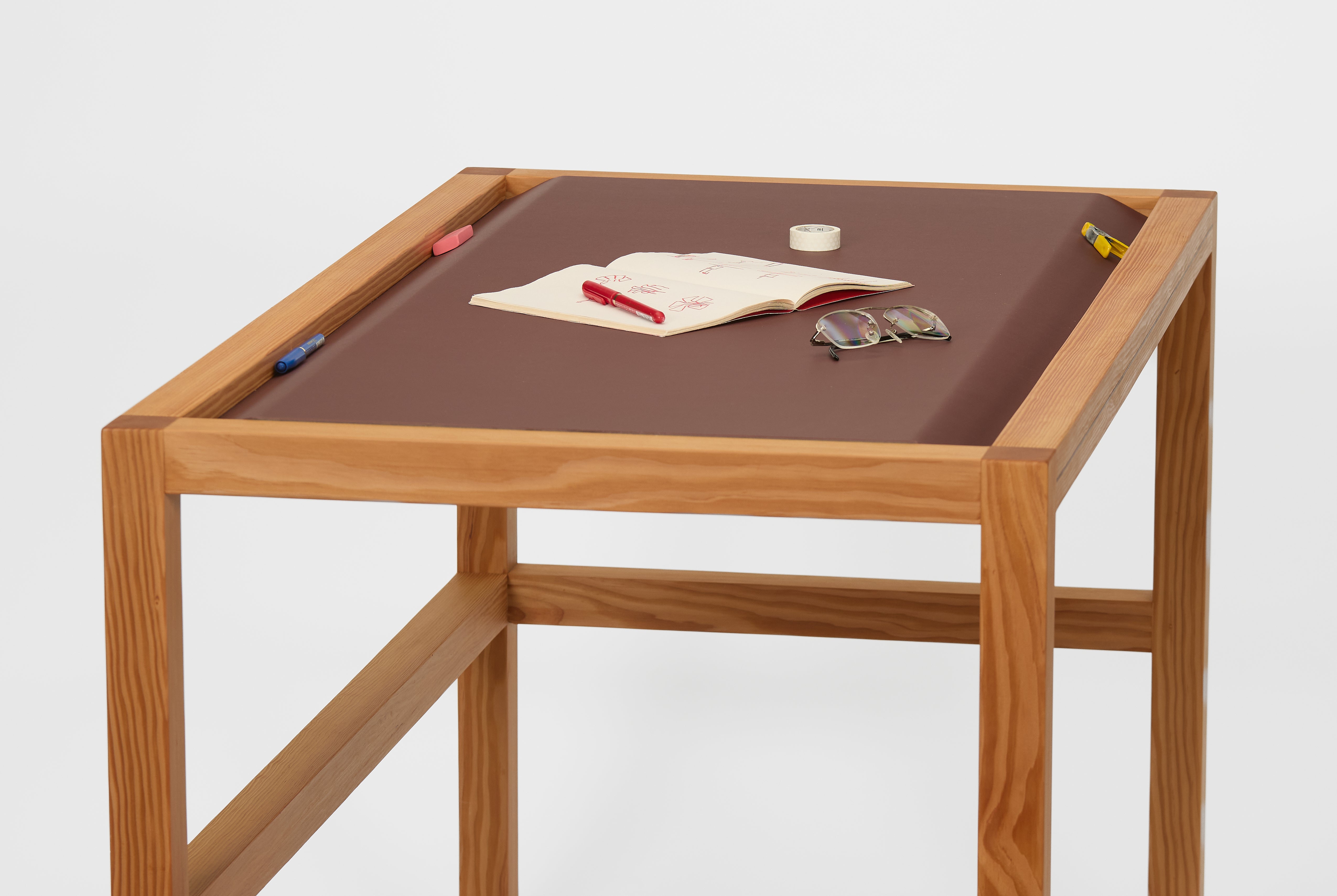 Table with woven linoleum component that creates end pockets 