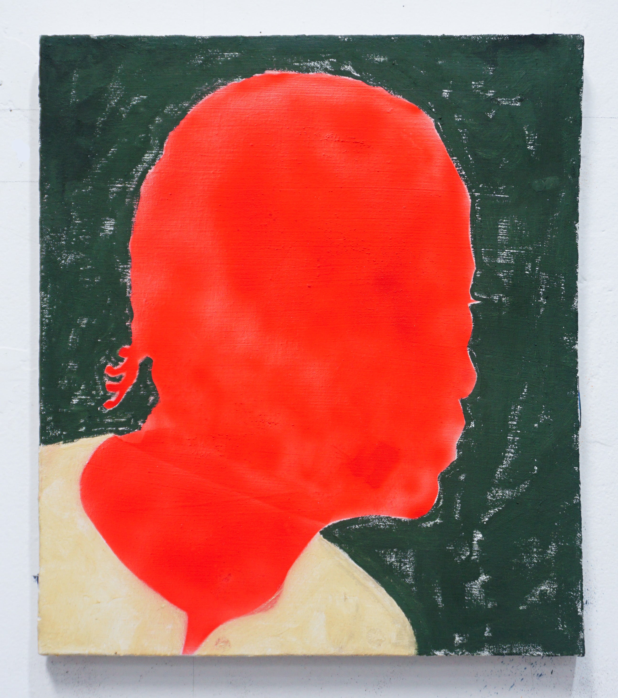 The bright red silhouette of a figure with cornrows is surrounded by a patchy forest green and wears a simple tan shirt. 
