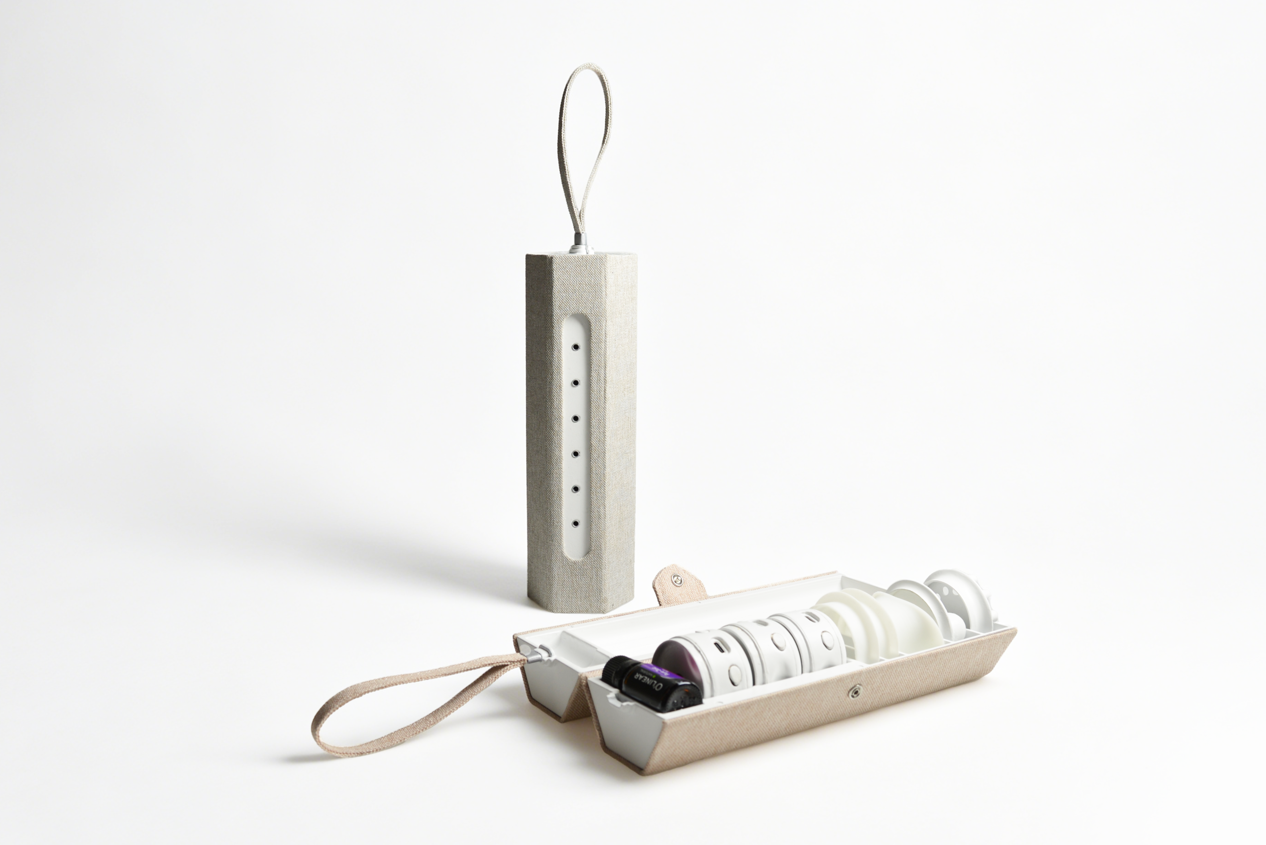 Two fabric-covered steam device cases in beige and gray; one open and laid flat revealing internal components, the other closed and upright.