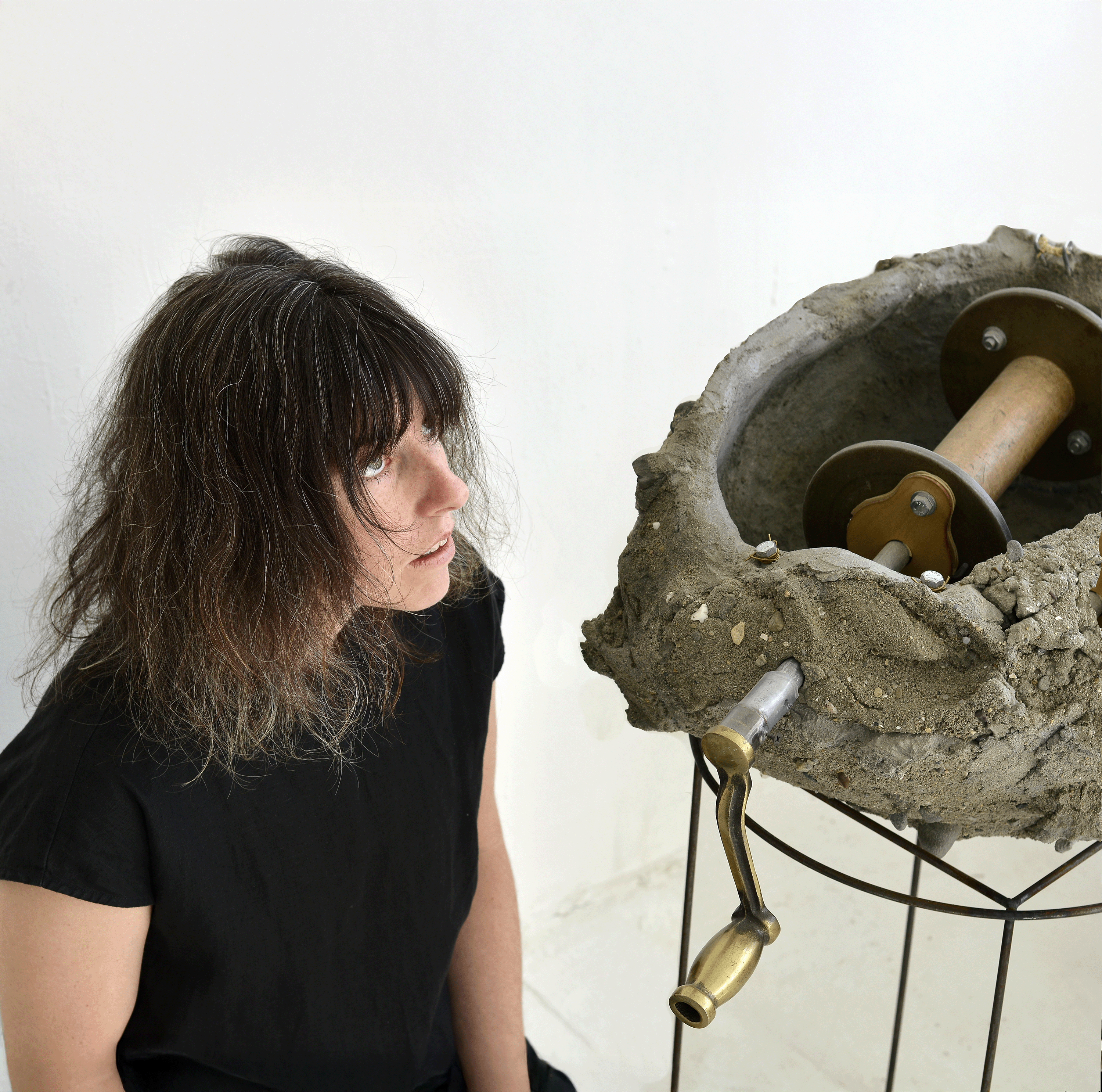 concrete object and vocalist sitting next to it