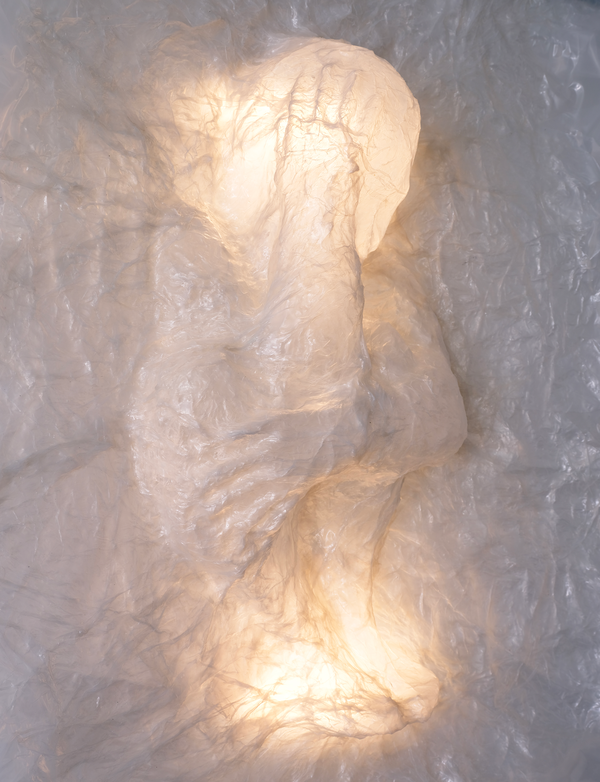 plastic in the shape of a crouched figure