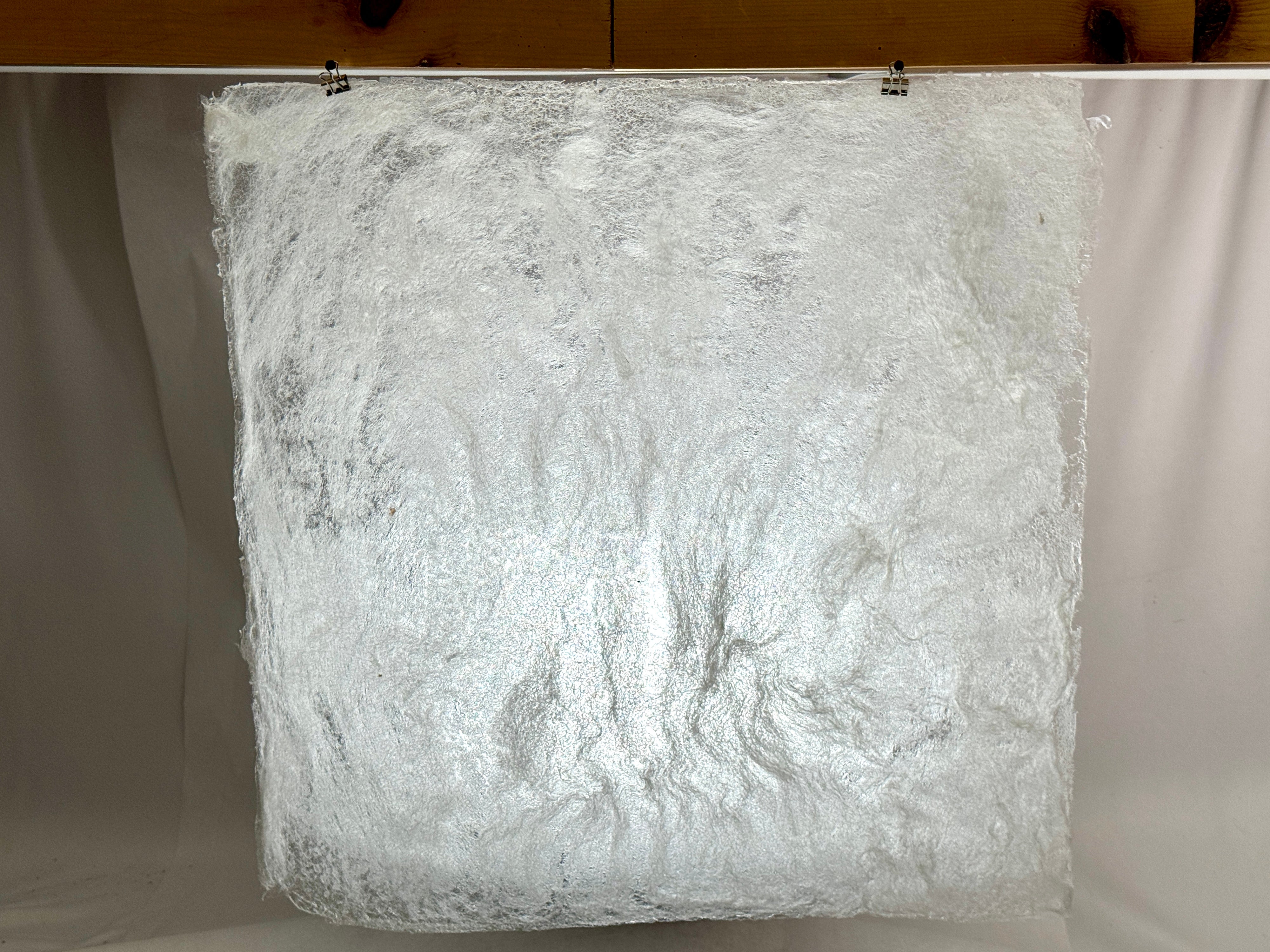 Sheets of material made from a small amount of wool and methylcellulose. 21 inches by 21 inches. The translucent texture allows light to easily enter the “shelter”—the final design—from the front and above, while blocking out some distractions.