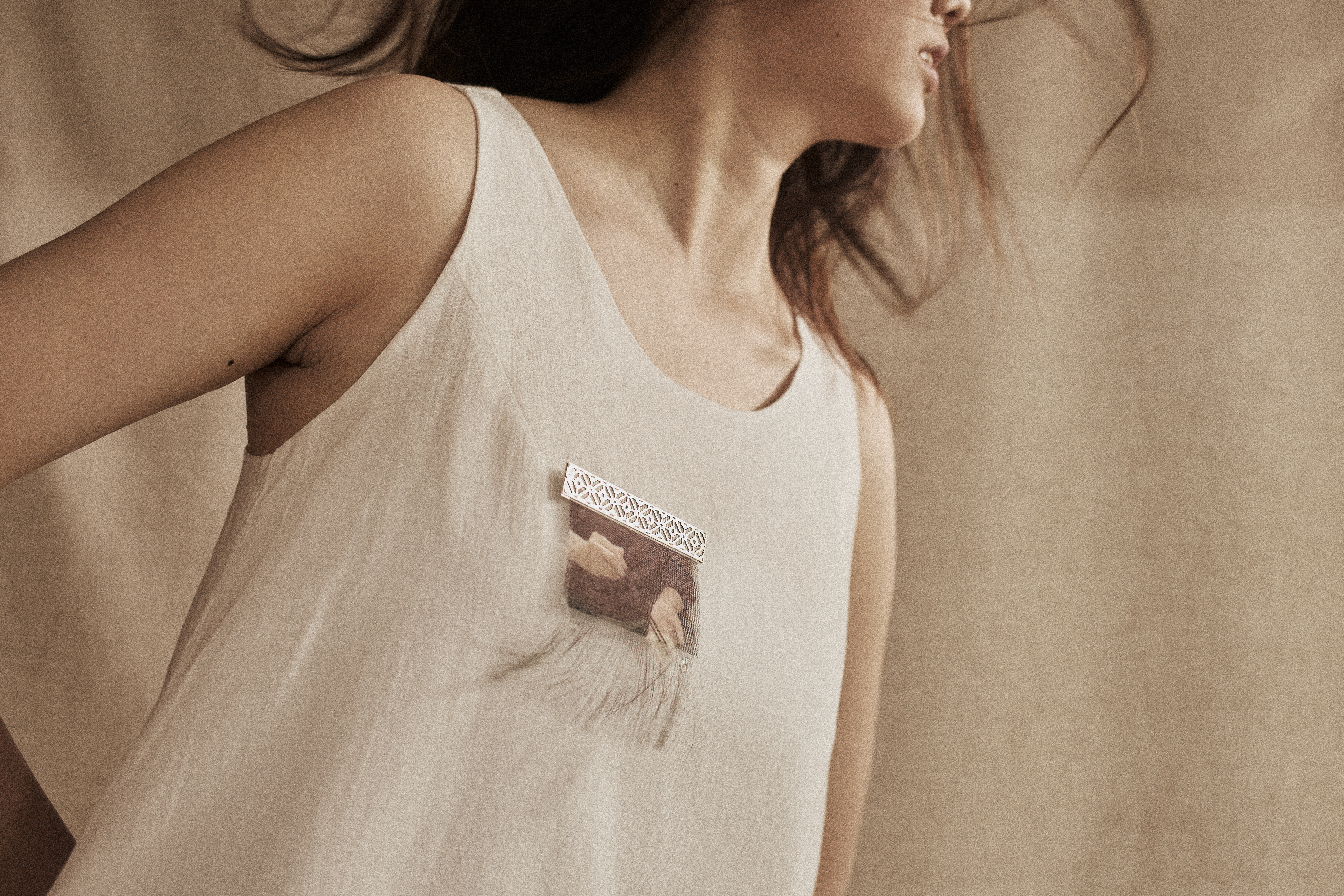 white tank top with fabric broach