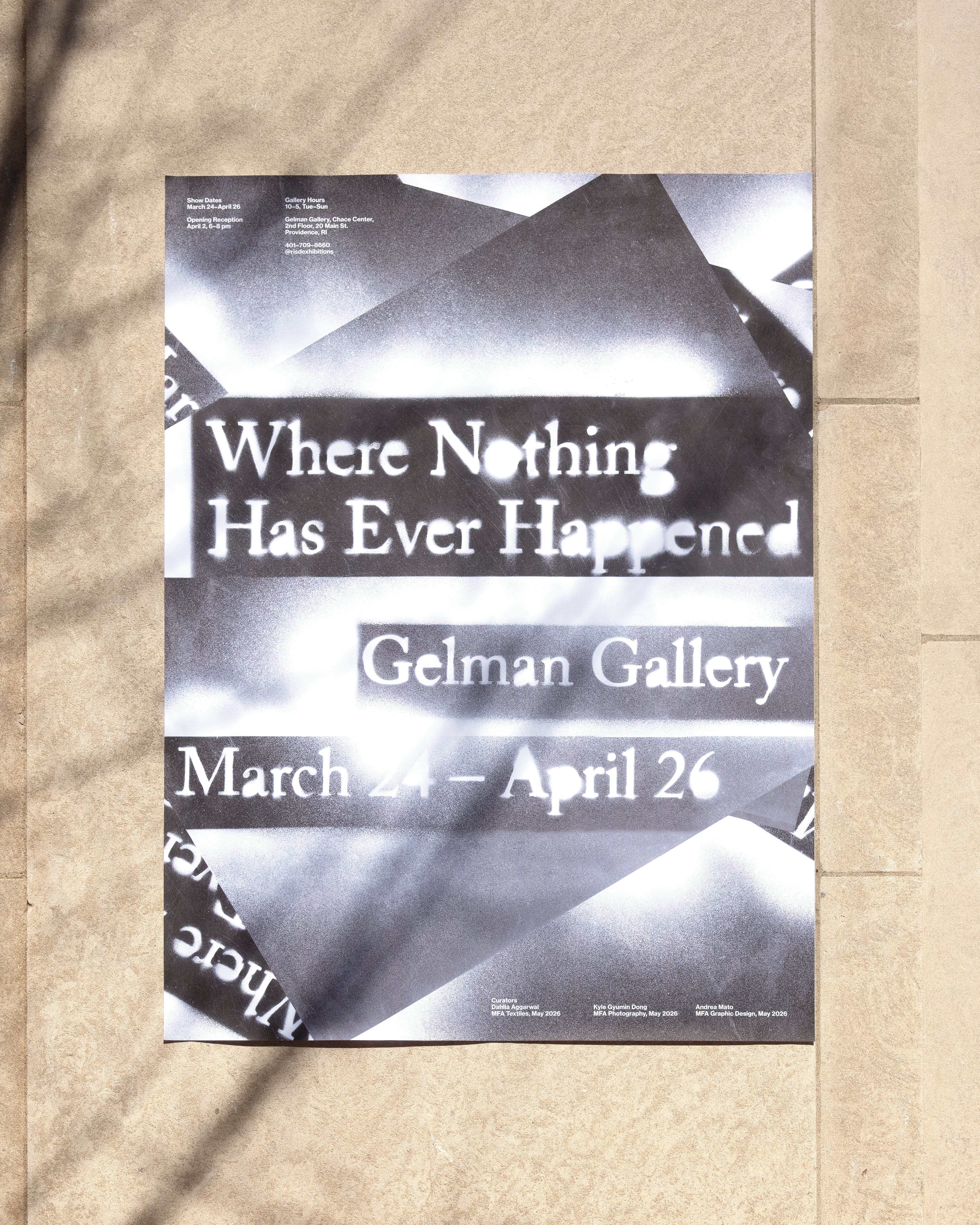 A black-and-white exhibition poster pinned to a stone wall, with leaf shadows cast across it. The poster reads "Where Nothing Has Ever Happened / Gelman Gallery / March 24 – April 26,"