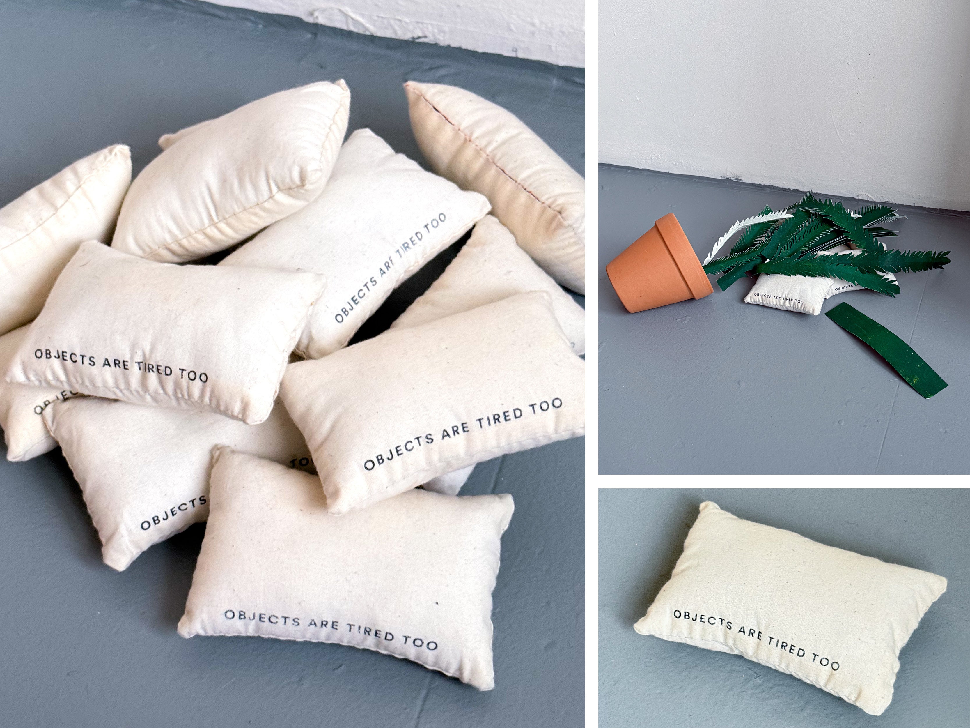 Several small off-white fabric pillows are piled on the floor, each printed with the phrase ‘OBJECTS ARE TIRED TOO’ in black capital letters. In another image, a terracotta flower pot lies tipped over beside green paper