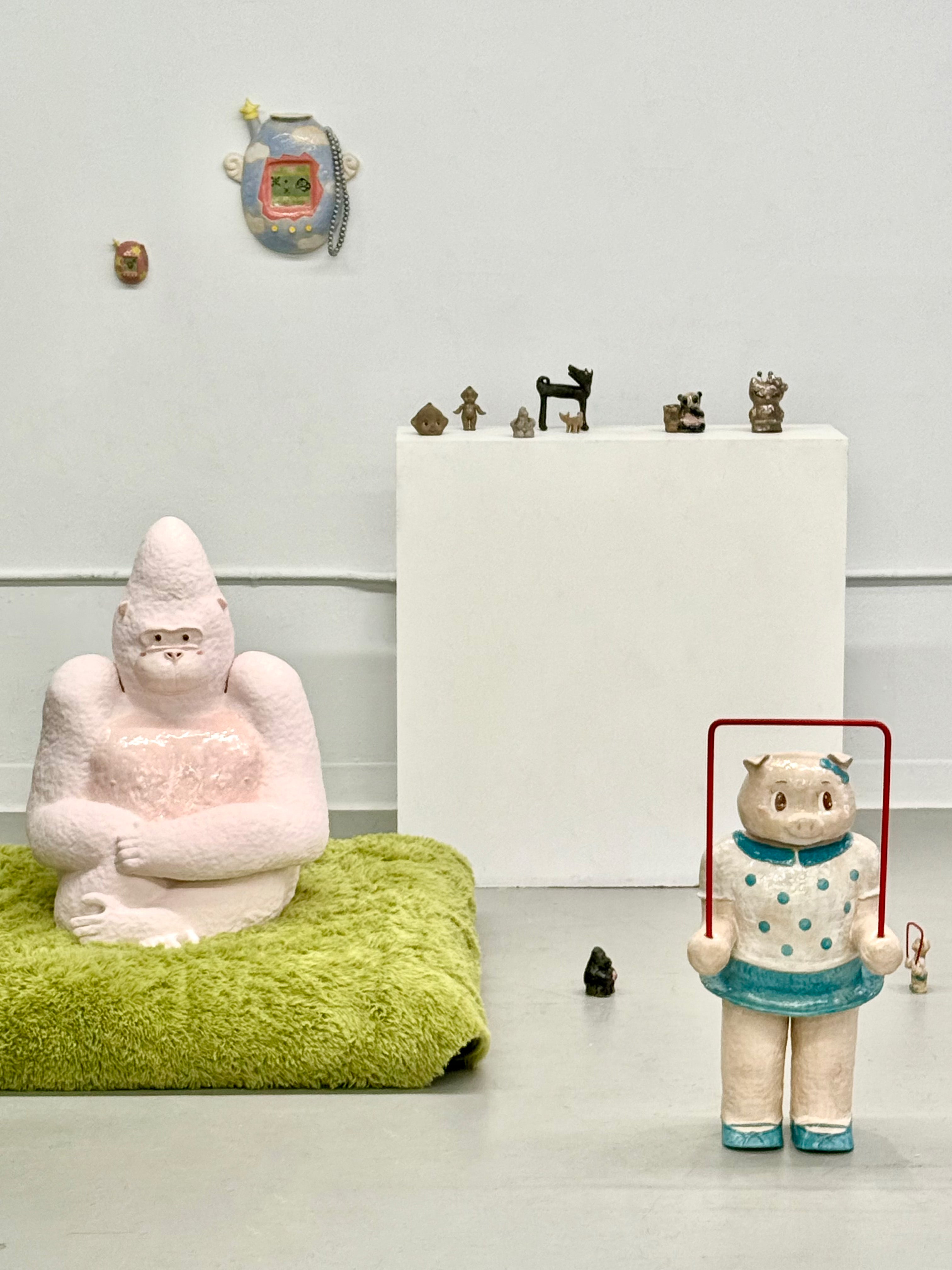Enlarged pink gorilla toy. Playful form referencing childhood toy. 