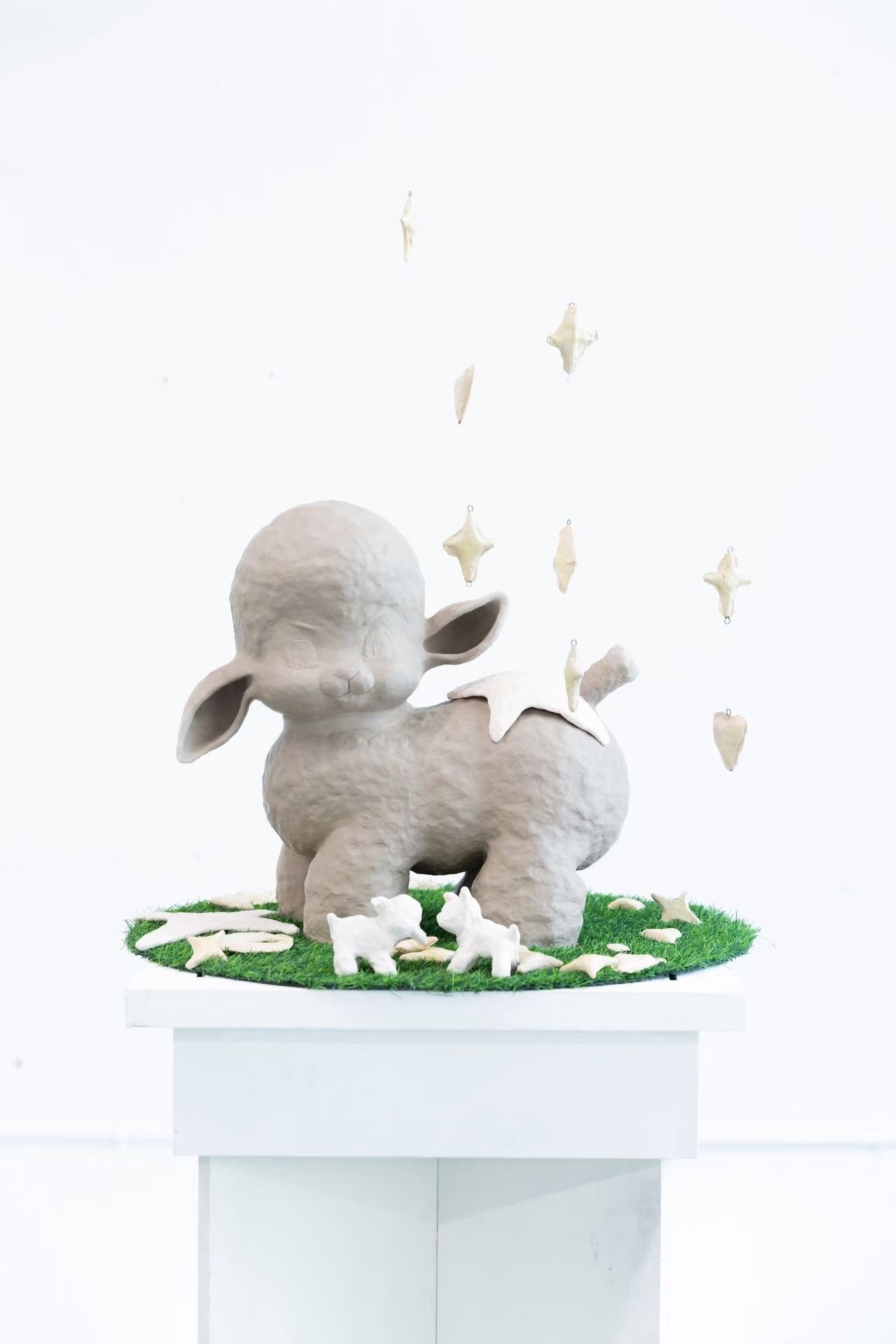 Enlarged vintage lamb toy with stars and hearts. 