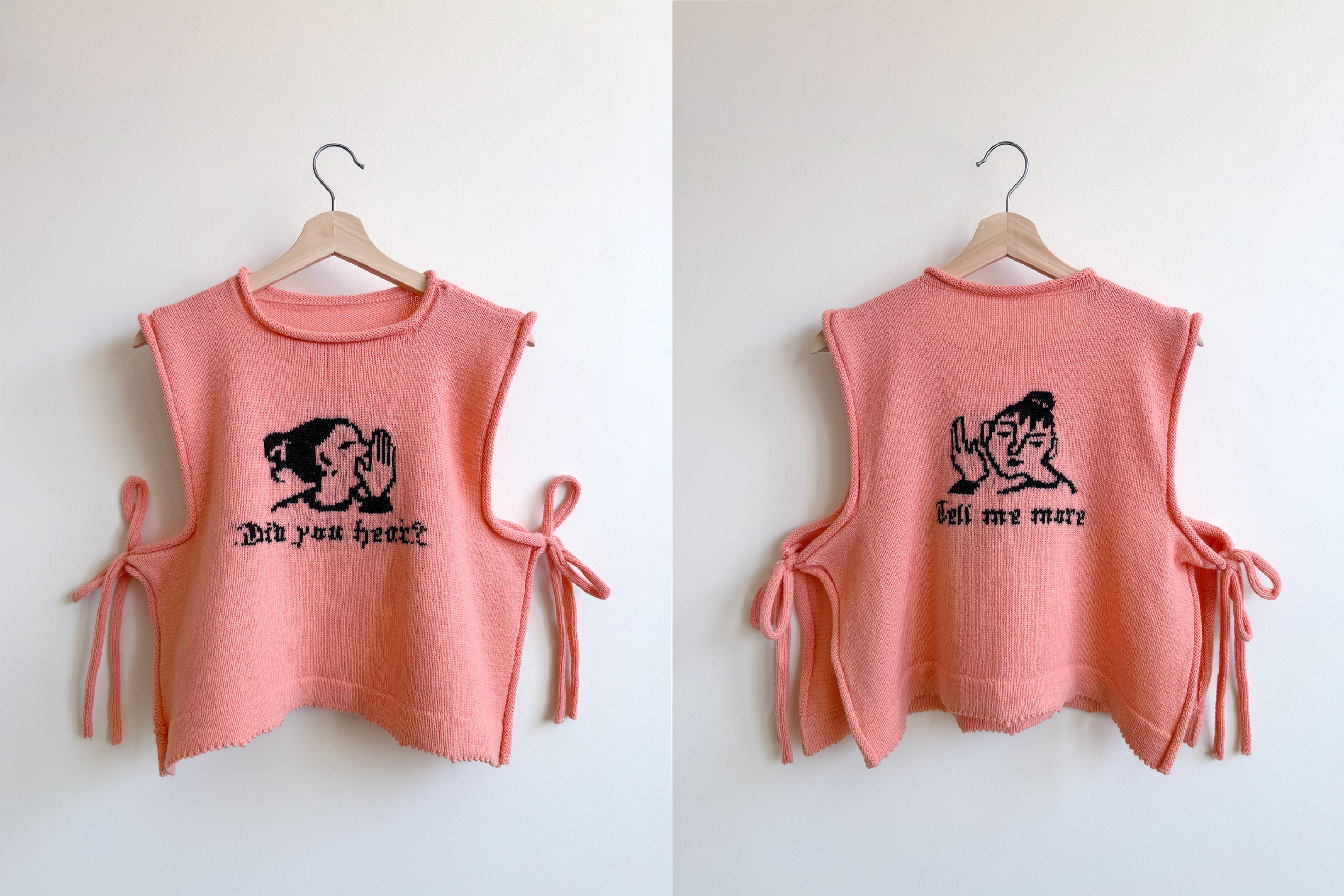 Two bright pink knitted vests side by side both with an image and text knitted in in black yarn. Left image is the front of the vest, it says "Did you hear?" with an icon