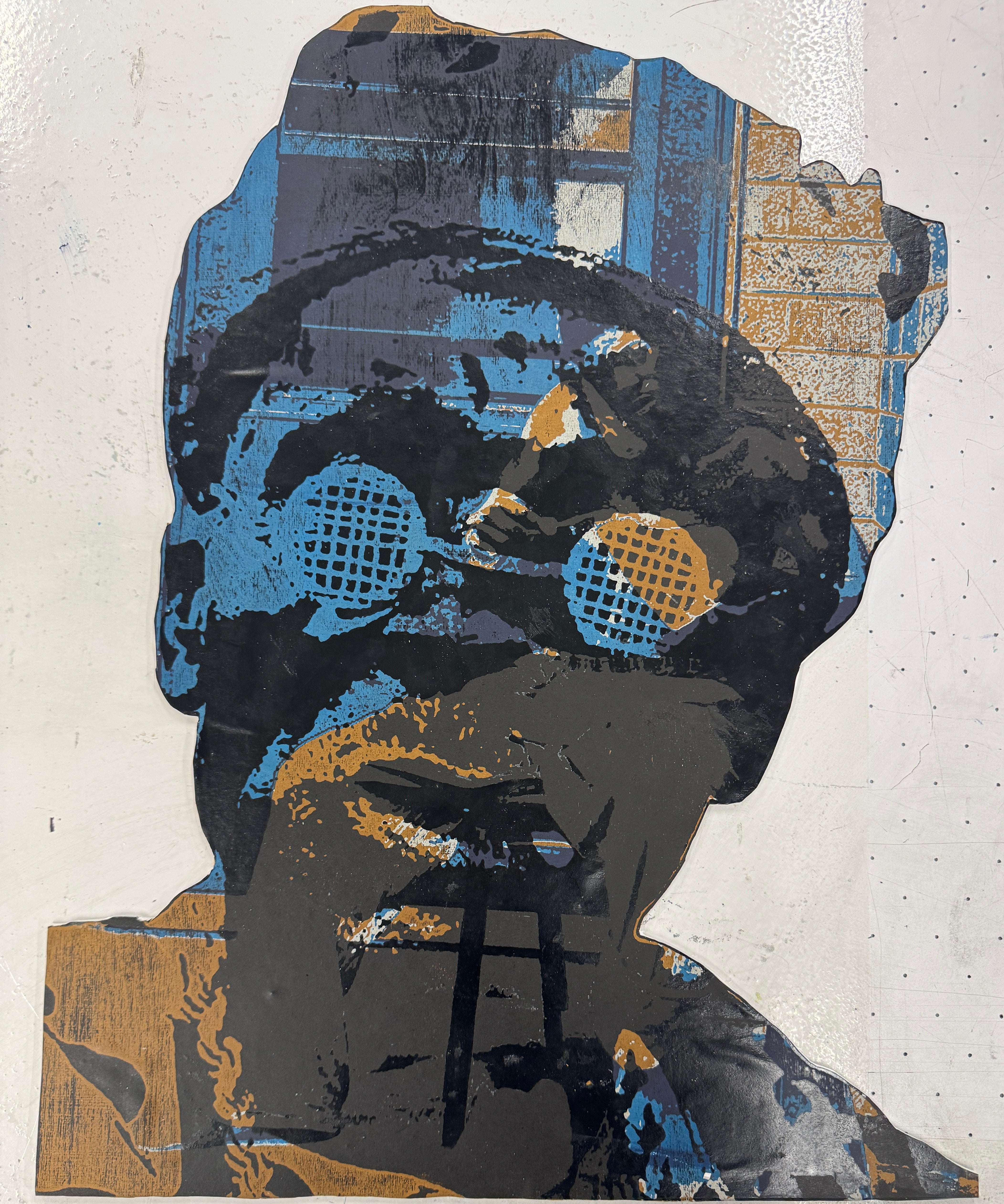 Light brown, blue, white, and black screenprint and woodcut of an Asante man’s face overlaid on a young man cleaning his shoes.