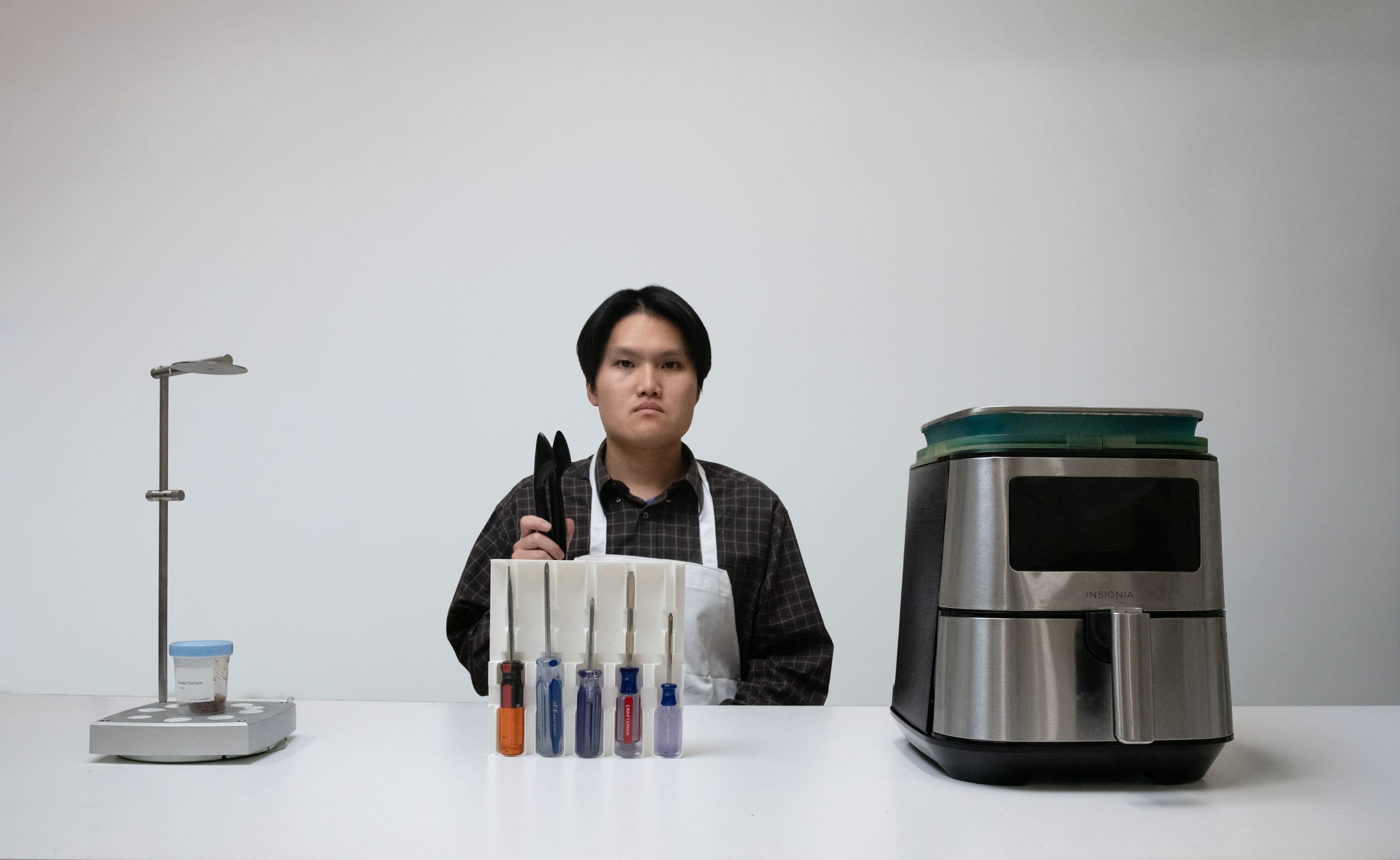 Shot of individual amongst the Boring Objects Bureau's experiments