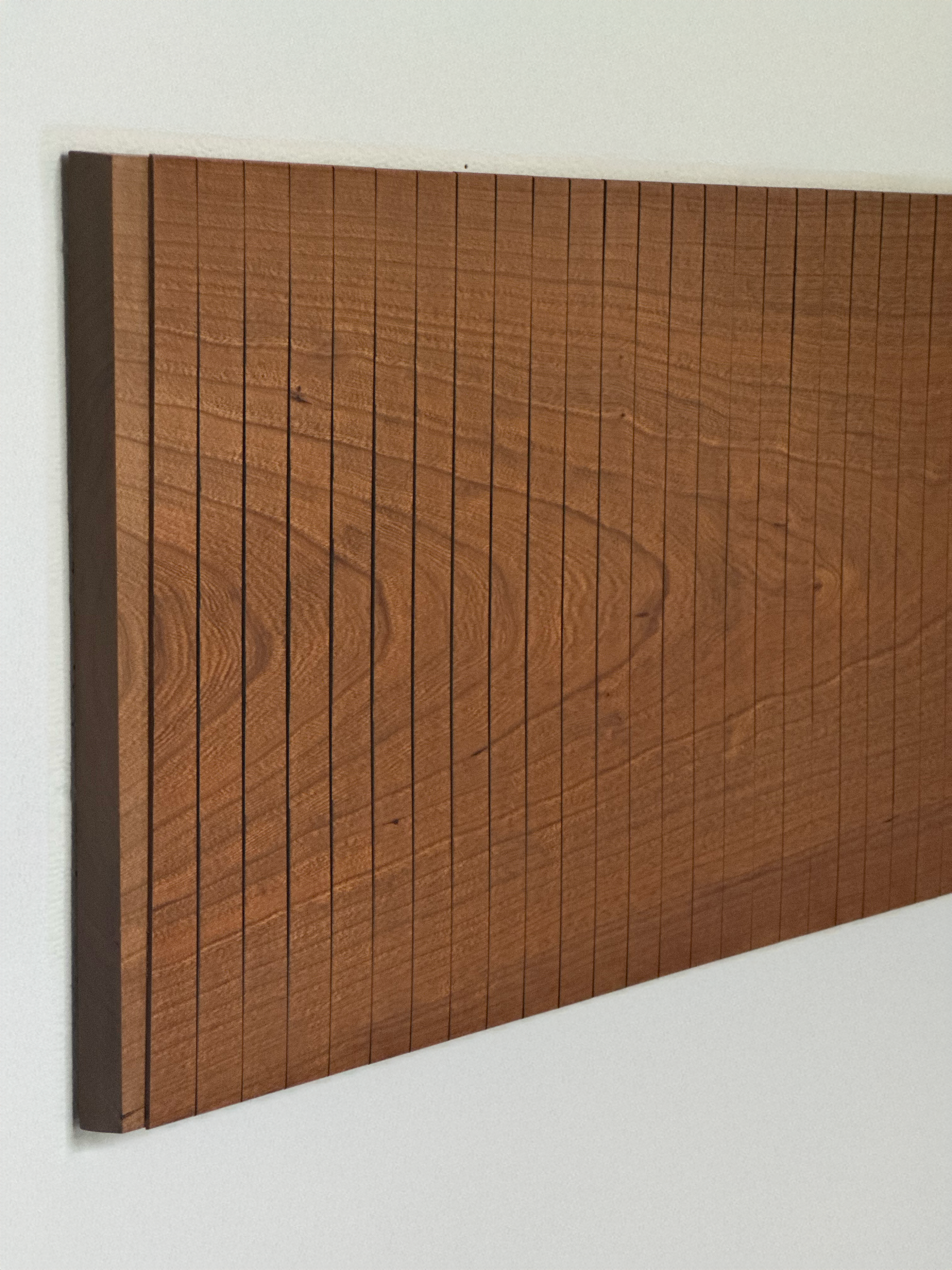 Rectangular cherry wall panel composed of evenly spaced vertical strips with continuous grain patterns across the surface.