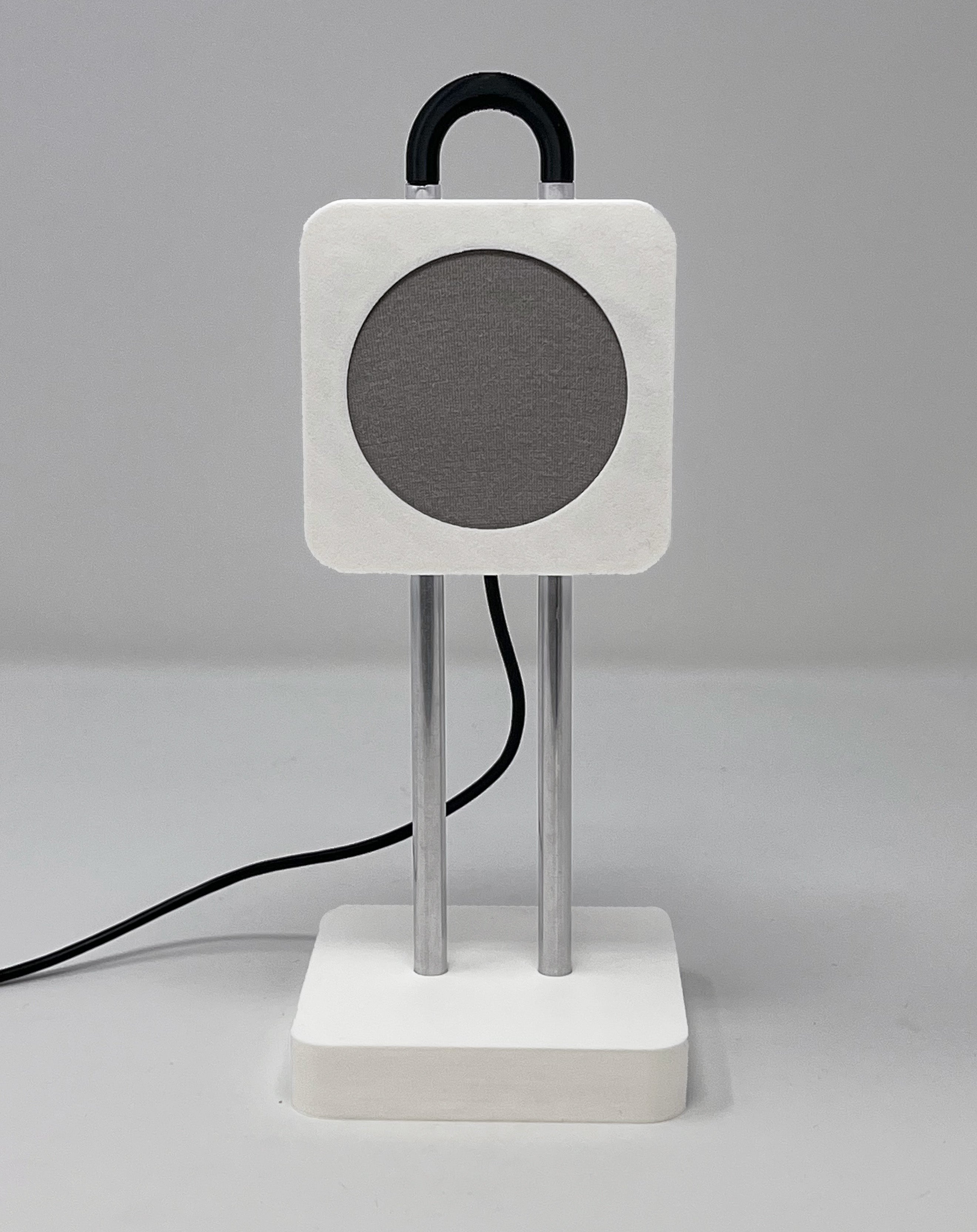 The Concord passive health tracker: a small white nightstand device with a circular gray radar sensor on a rounded square head, mounted on two chrome posts atop a square base, with a black handle on top.