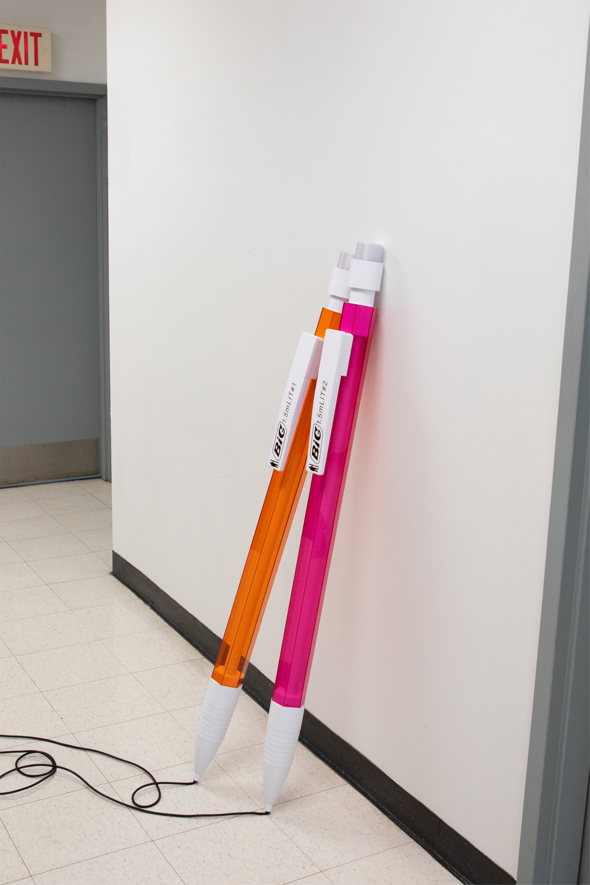 An oversized mechanical pencil reimagined as a light, with a cord extending like graphite lead. You press down the eraser to turn the light on and off. 