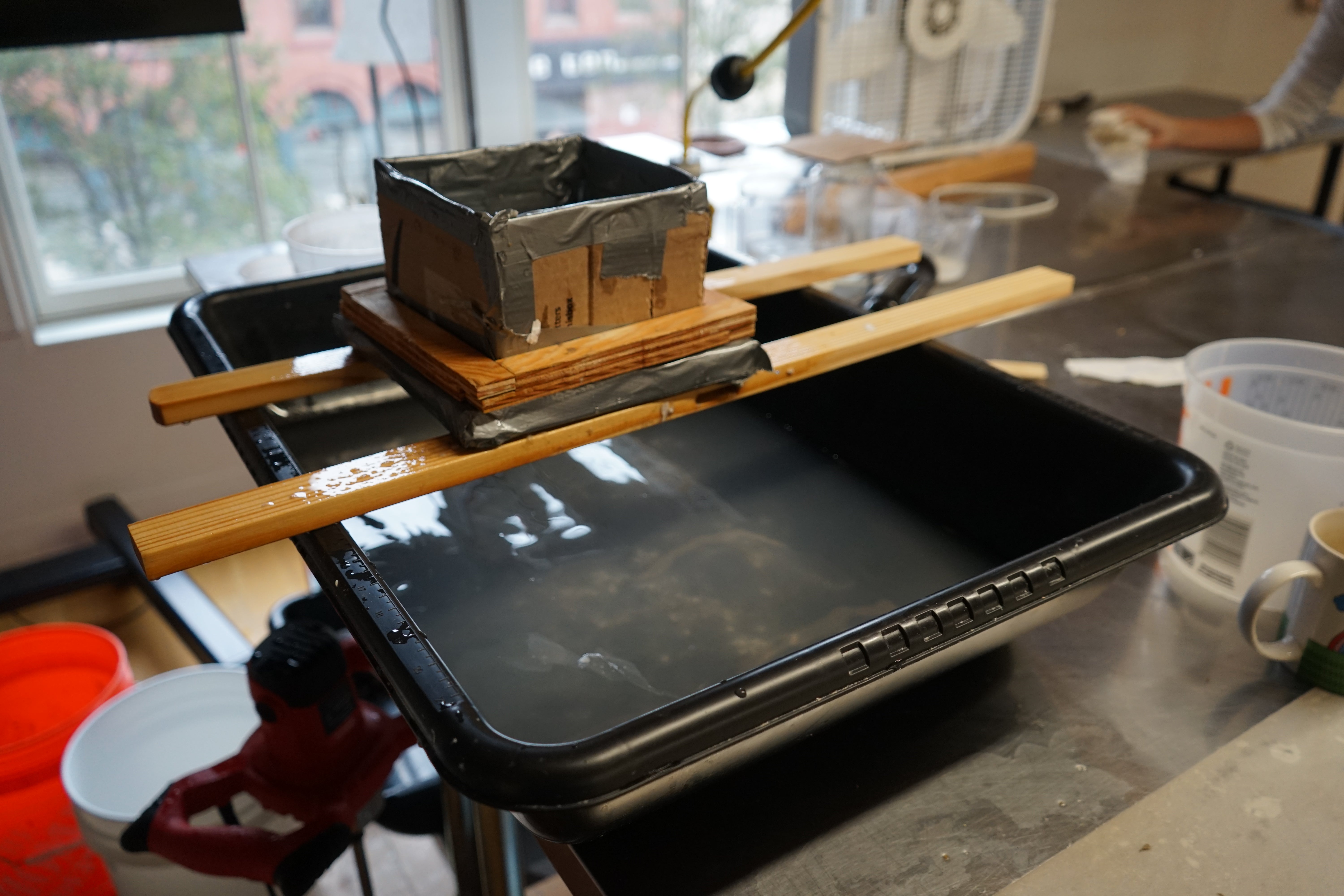 Image of studio working space with paper making equipment. 