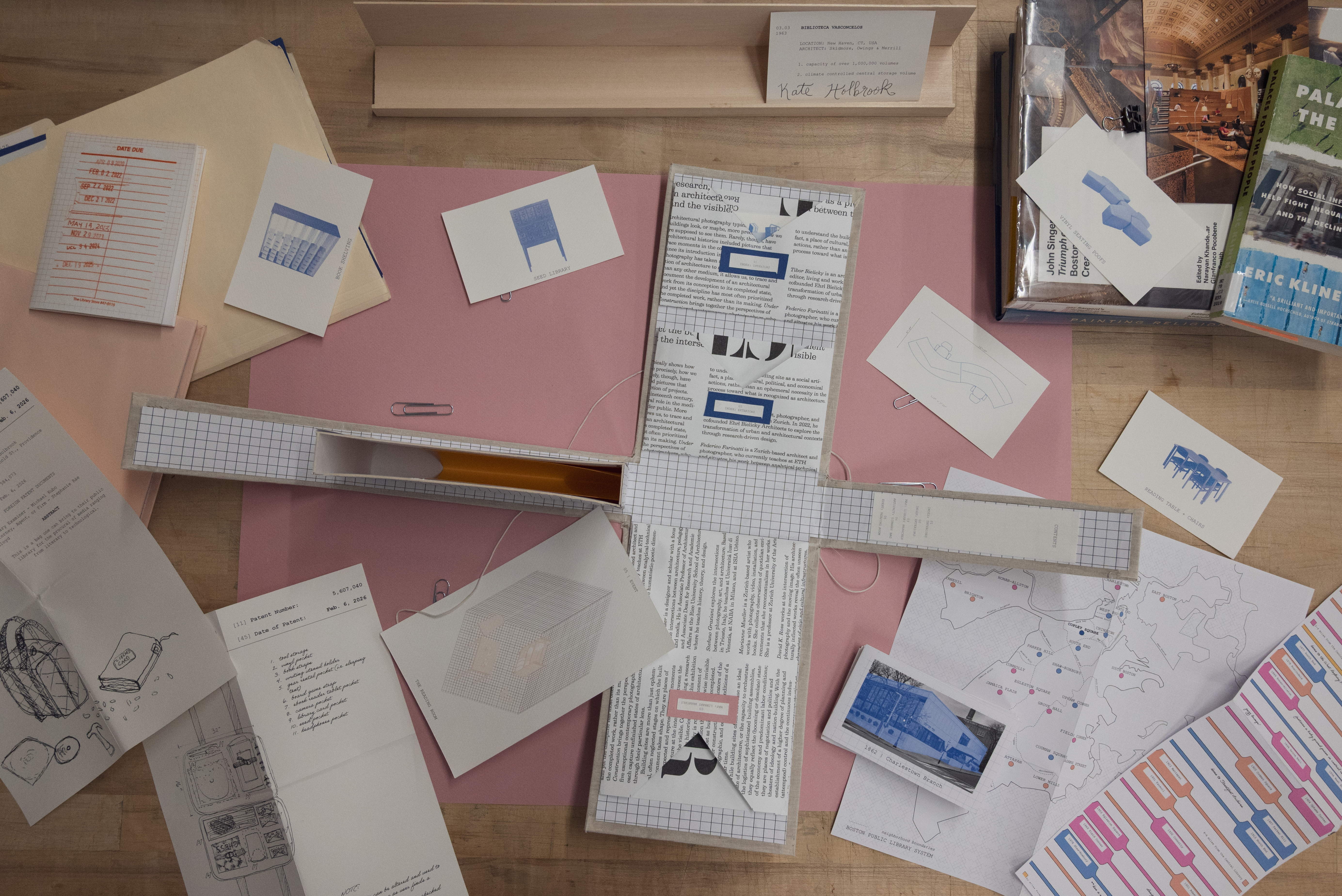 an image of various colored and sized papers scattered on a desk 