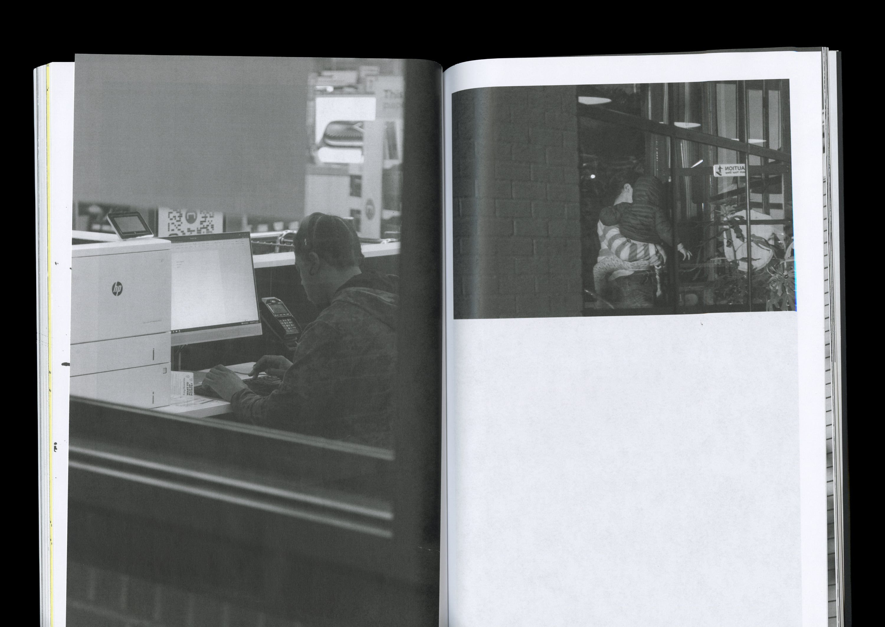 Publication spread with two black and white photographs: left page shows person at a computer in office setting; right page depicts figures entering building entrance.