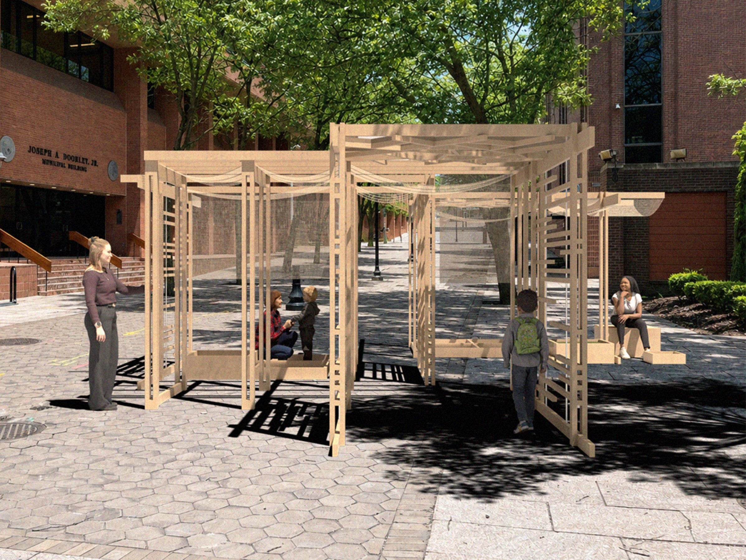 Module blend into a boulevard where red brick government building and large sidewalk trees cast shadows that interplays with shadow from the module.