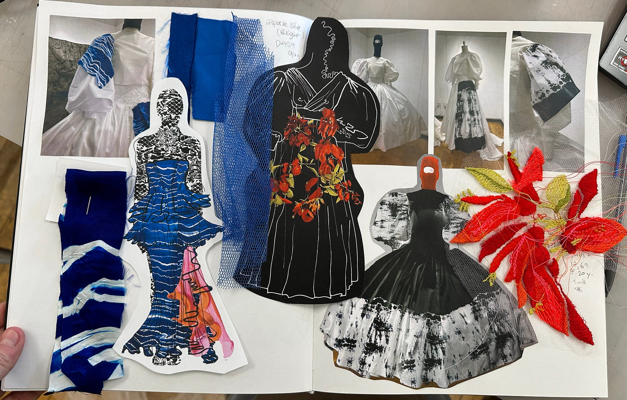 Sketchbook showing design process with collage of sketches, garment photos, textile swatches, fabric samples, and red embroidered floral tests